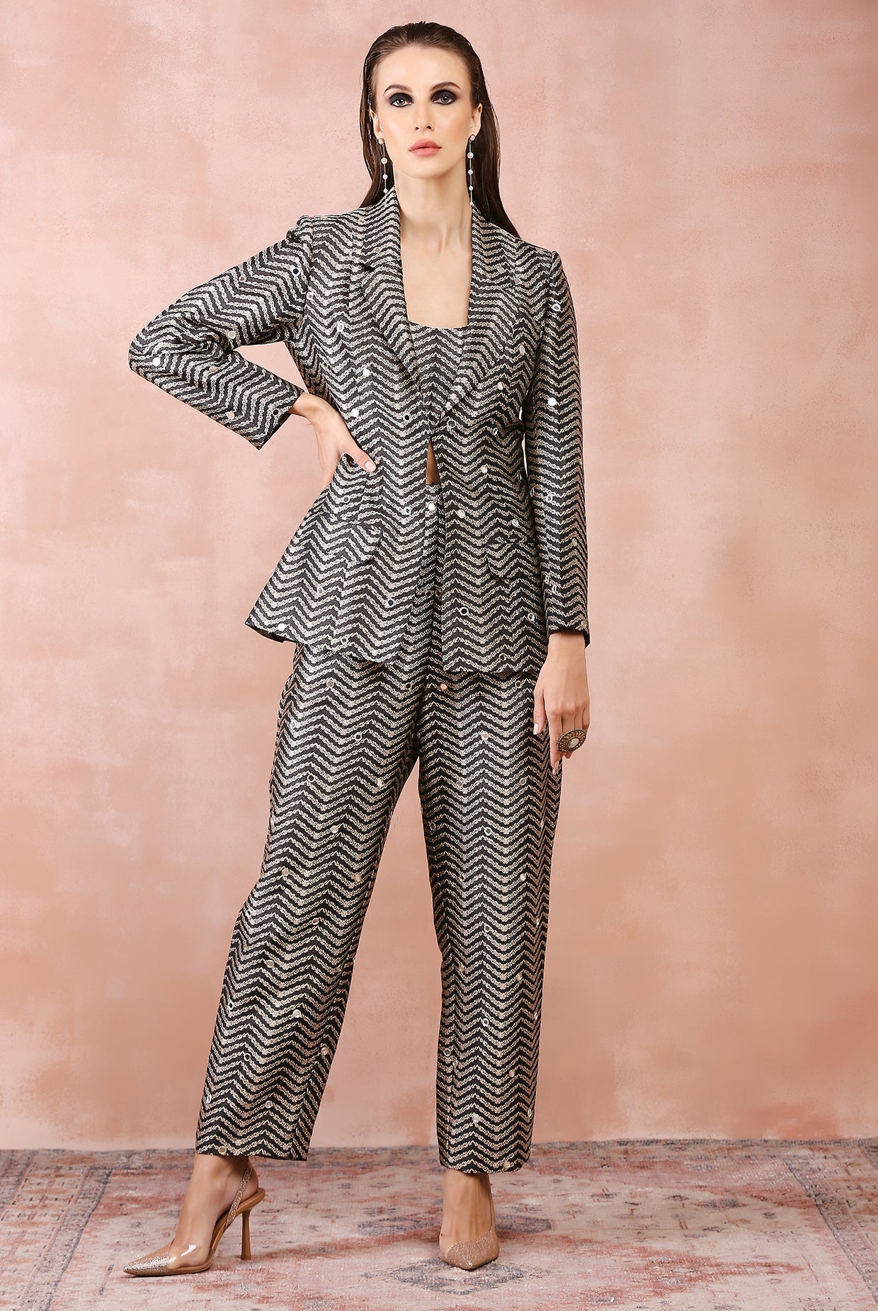 Black embroidered blazer with bustier and pant.