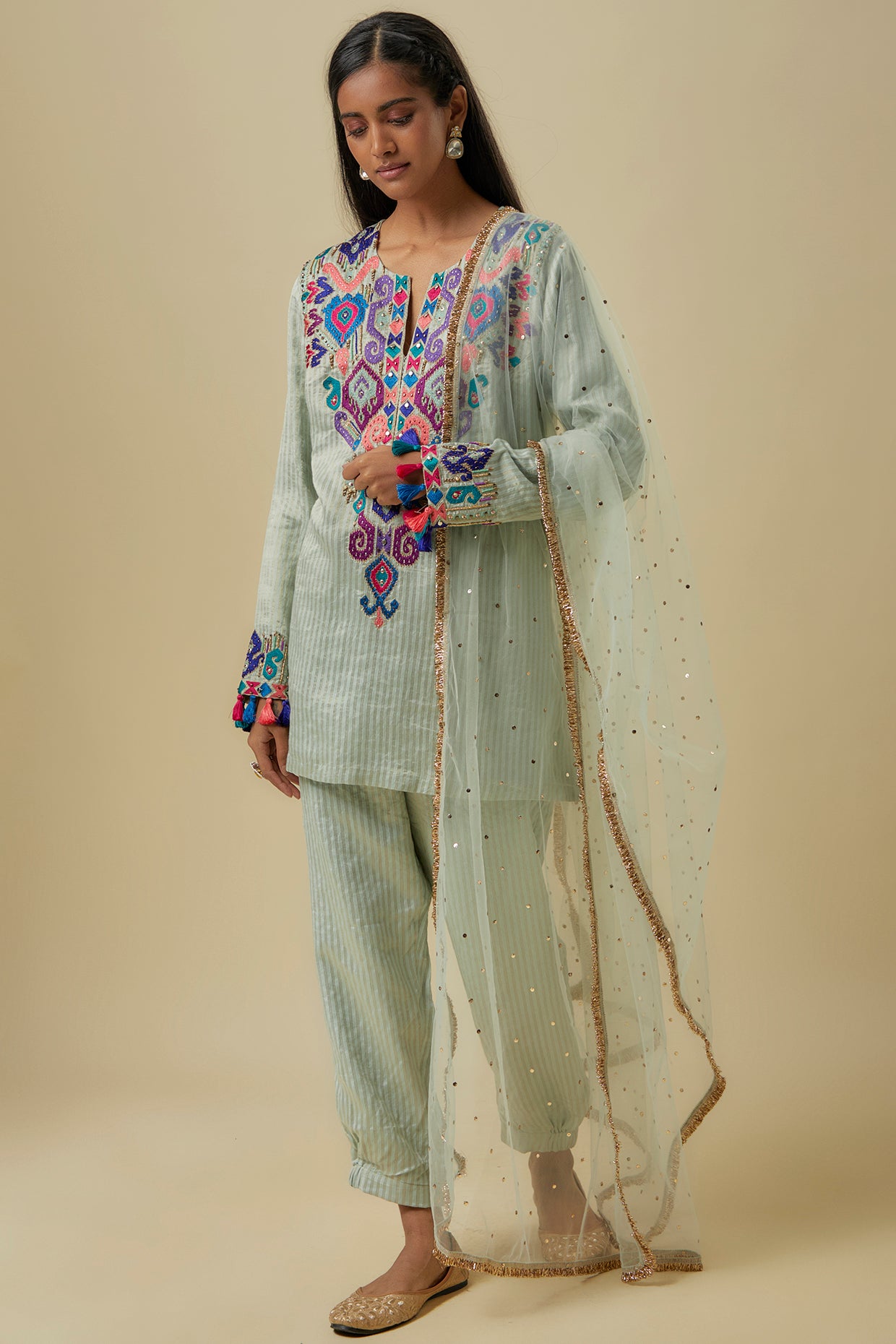 Pale Blue Gold Stripes Chanderi Embroidered Yoke Short Kurta And Jogger Pants With Mukaish Net Dupatta.