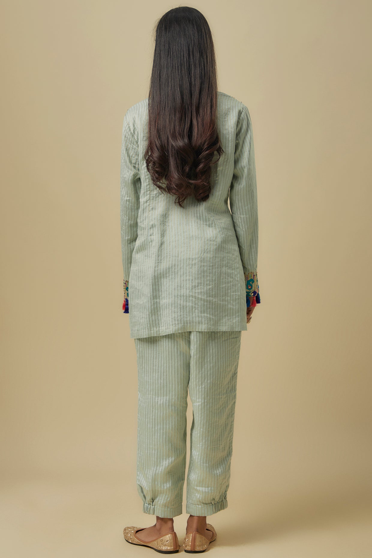 Pale Blue Gold Stripes Chanderi Embroidered Yoke Short Kurta And Jogger Pants With Mukaish Net Dupatta.