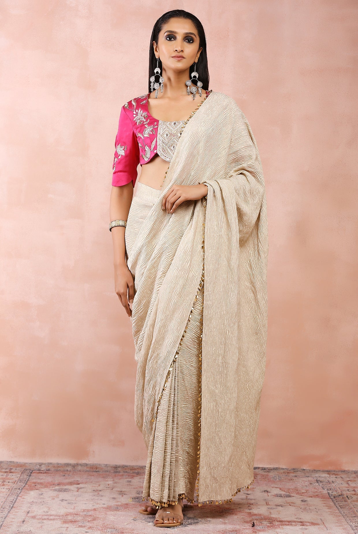 Hot pink embroidered choli with silver organza crushed tissue saree.