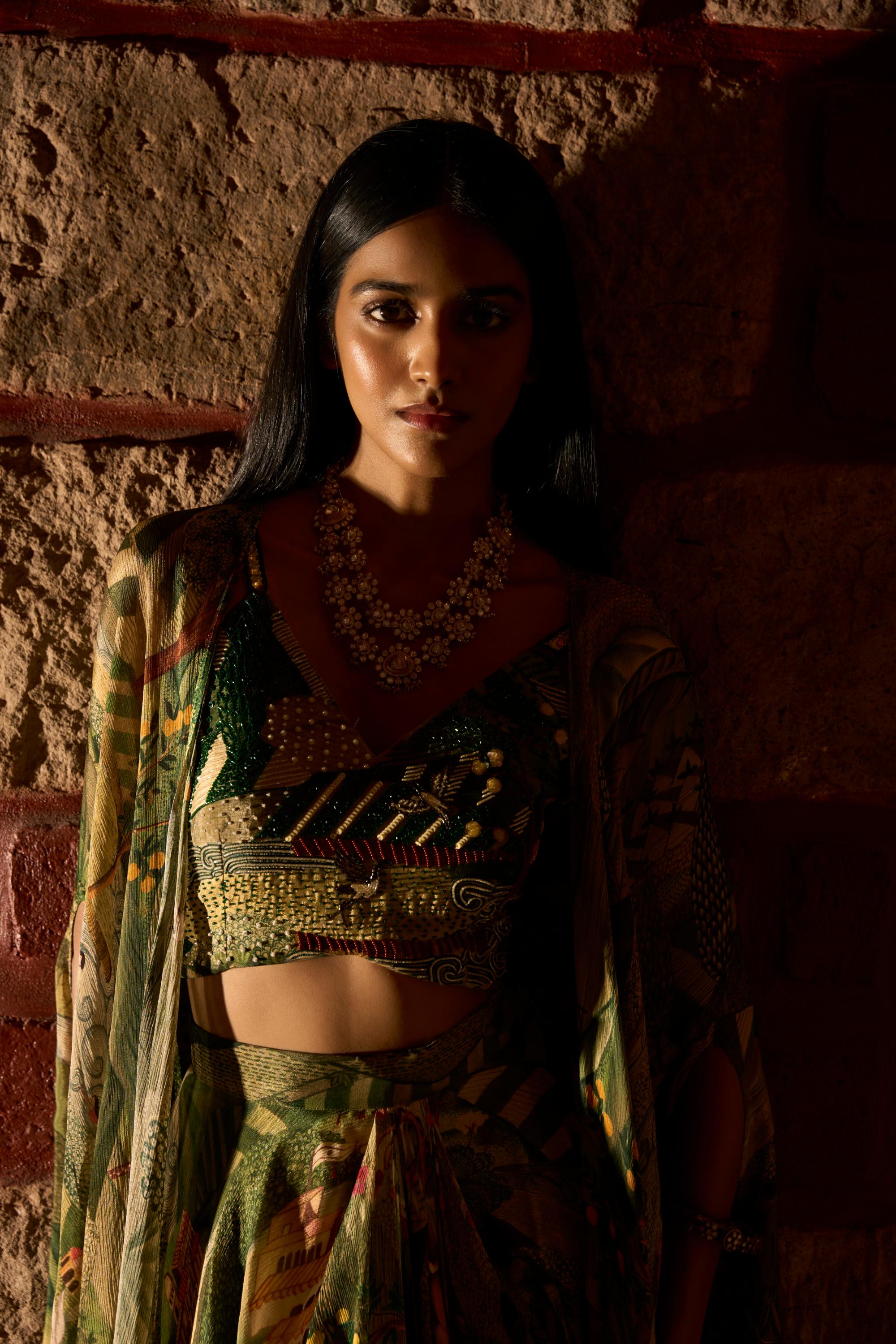 Enchanted Canopy ā Jungle Print Cowl Skirt Set with Handwork Blouse and Shrug