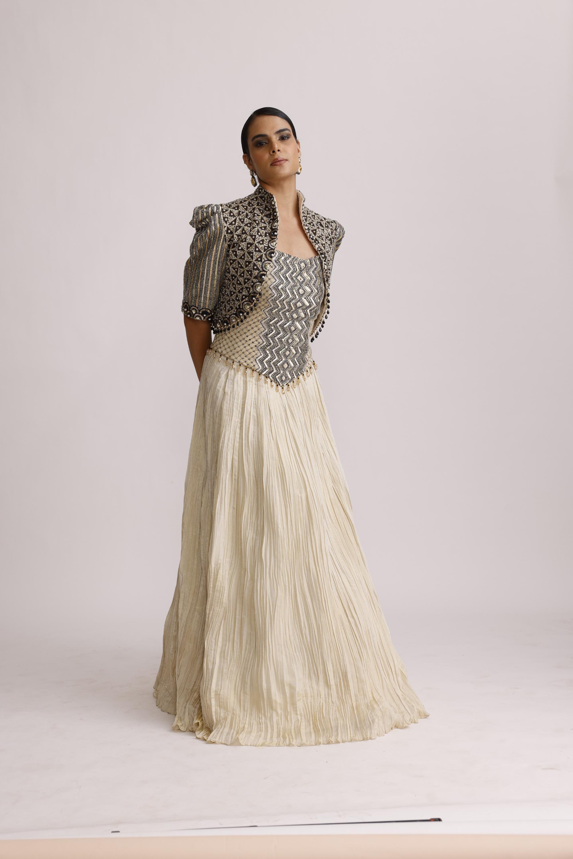 IVORY CORSET TOP WITH CRUSH SKIRT AND PAIRED WITH AJRAKH JACKET