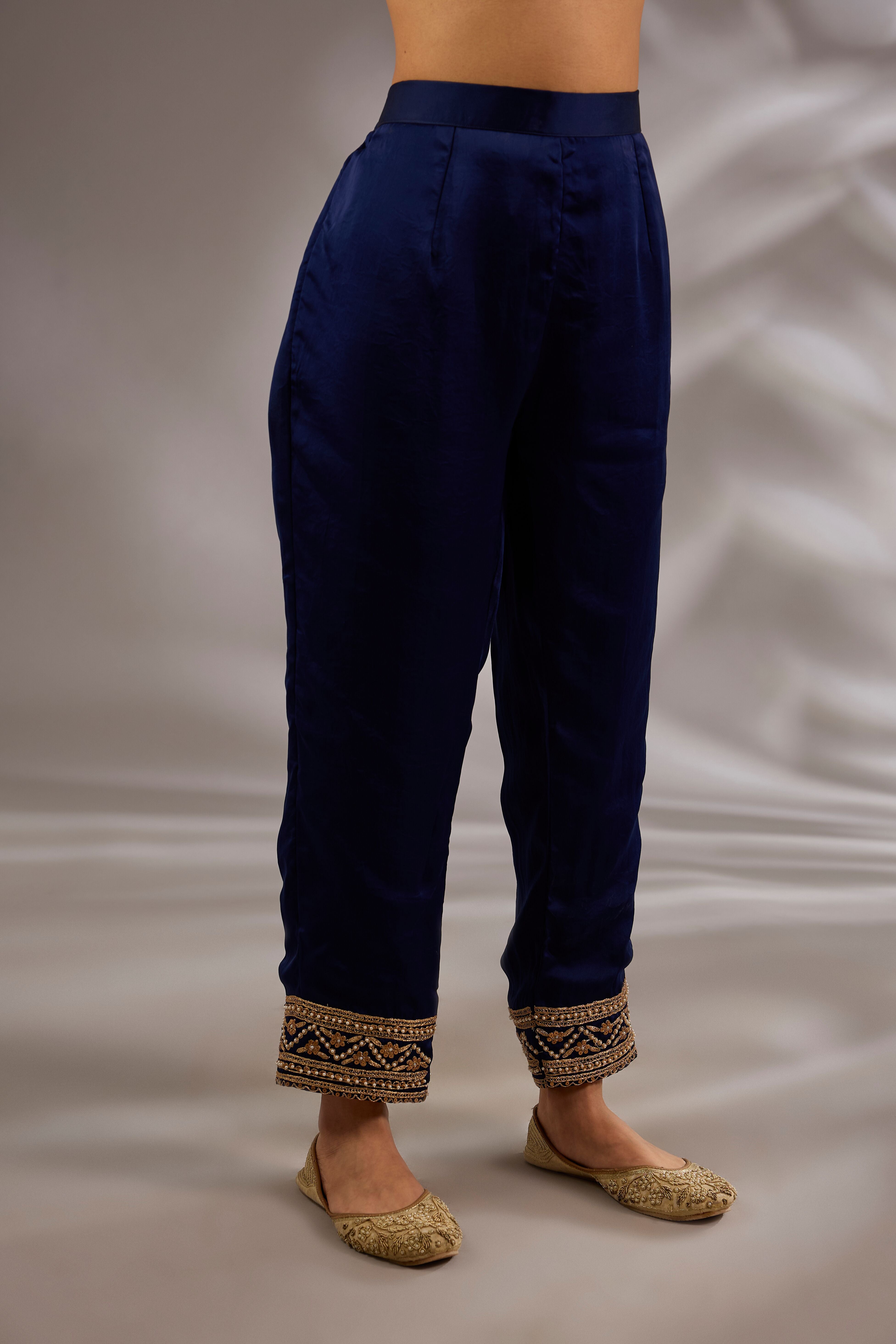 A-line kurta in satin organza base with dori hand embroidery.