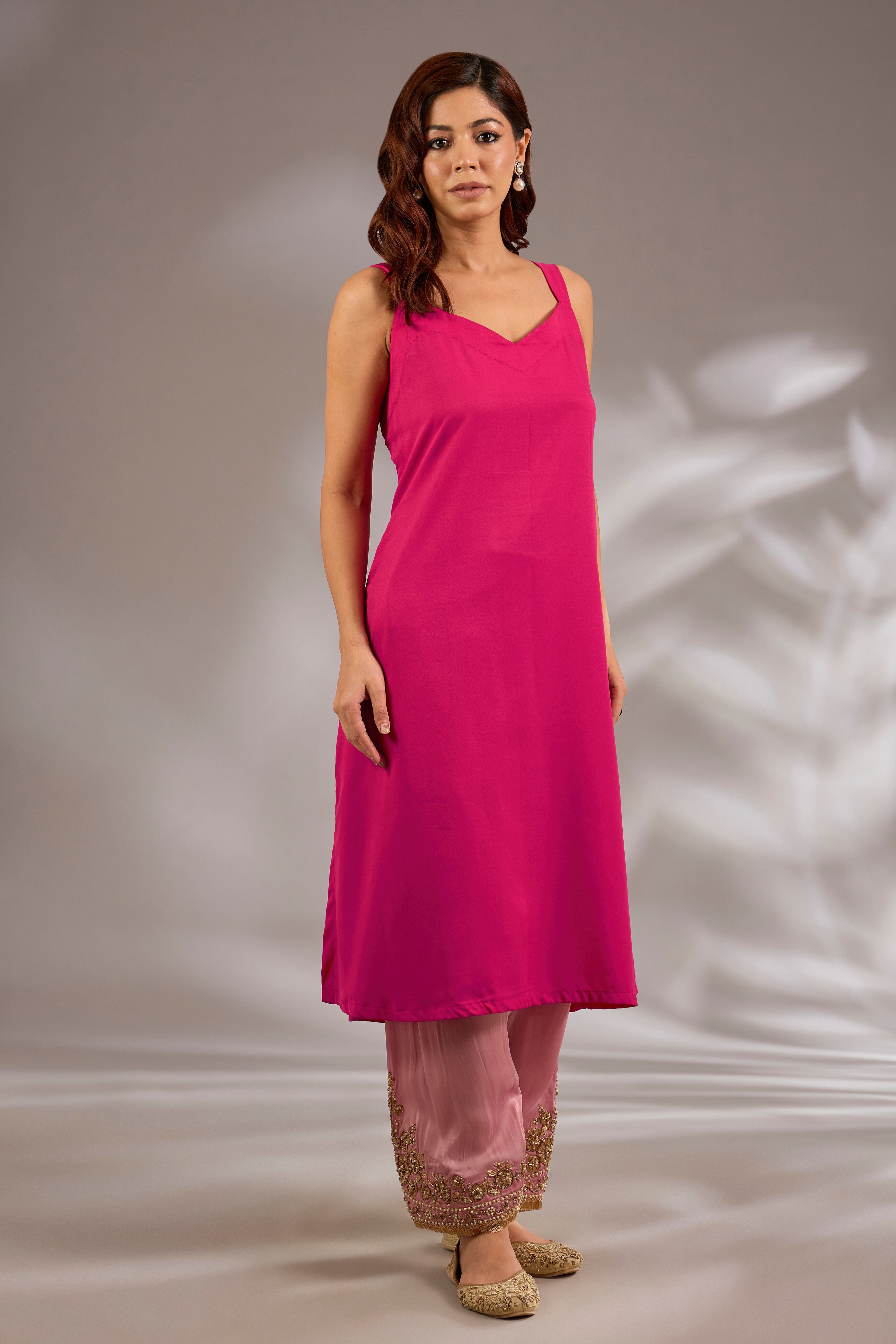 A-line kurta in satin organza base with dori hand embroidery.