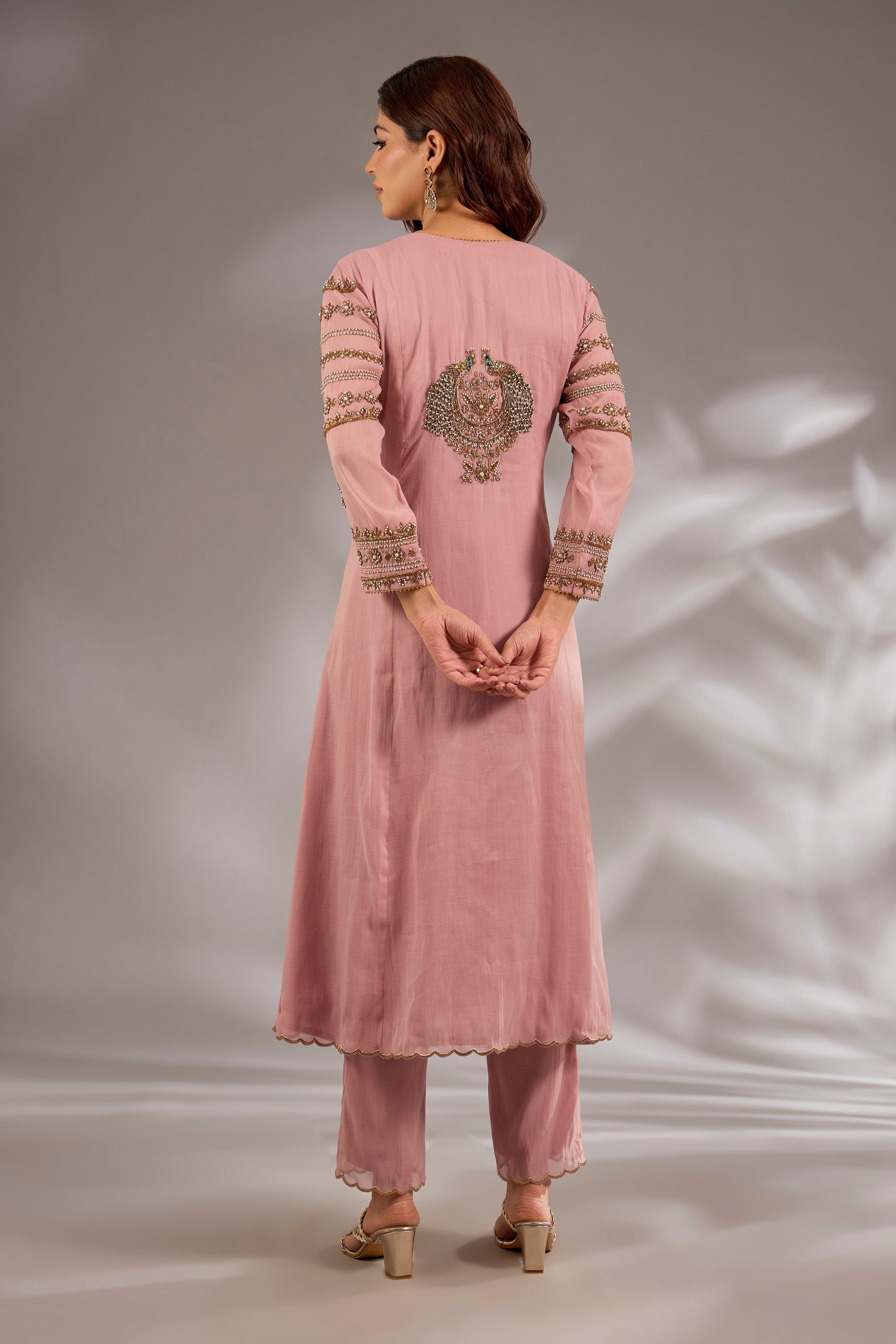 Flared kurta in mul chanderi base with hand embroidery.