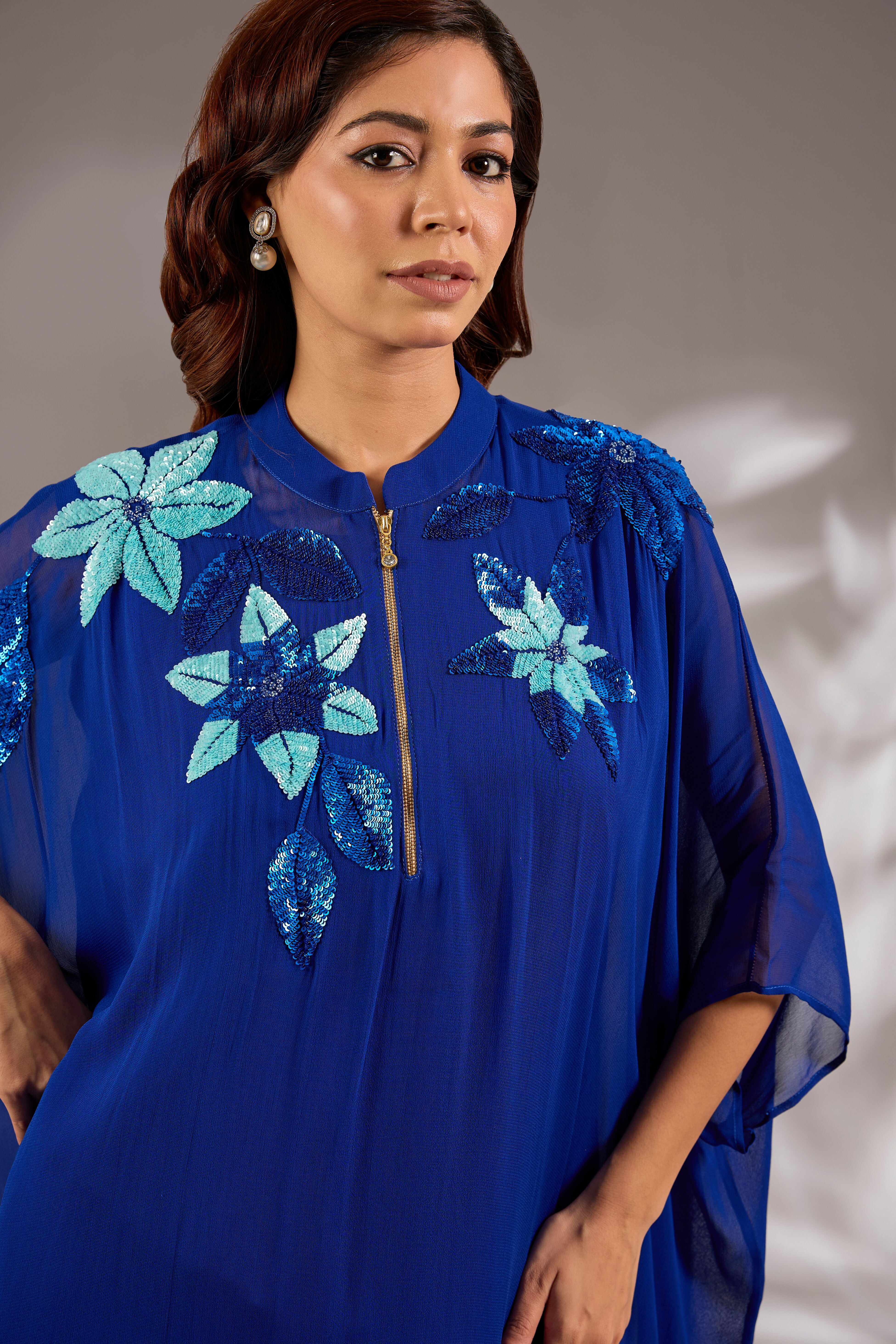 Kaftan in georgette base with sequins hand embroidery.