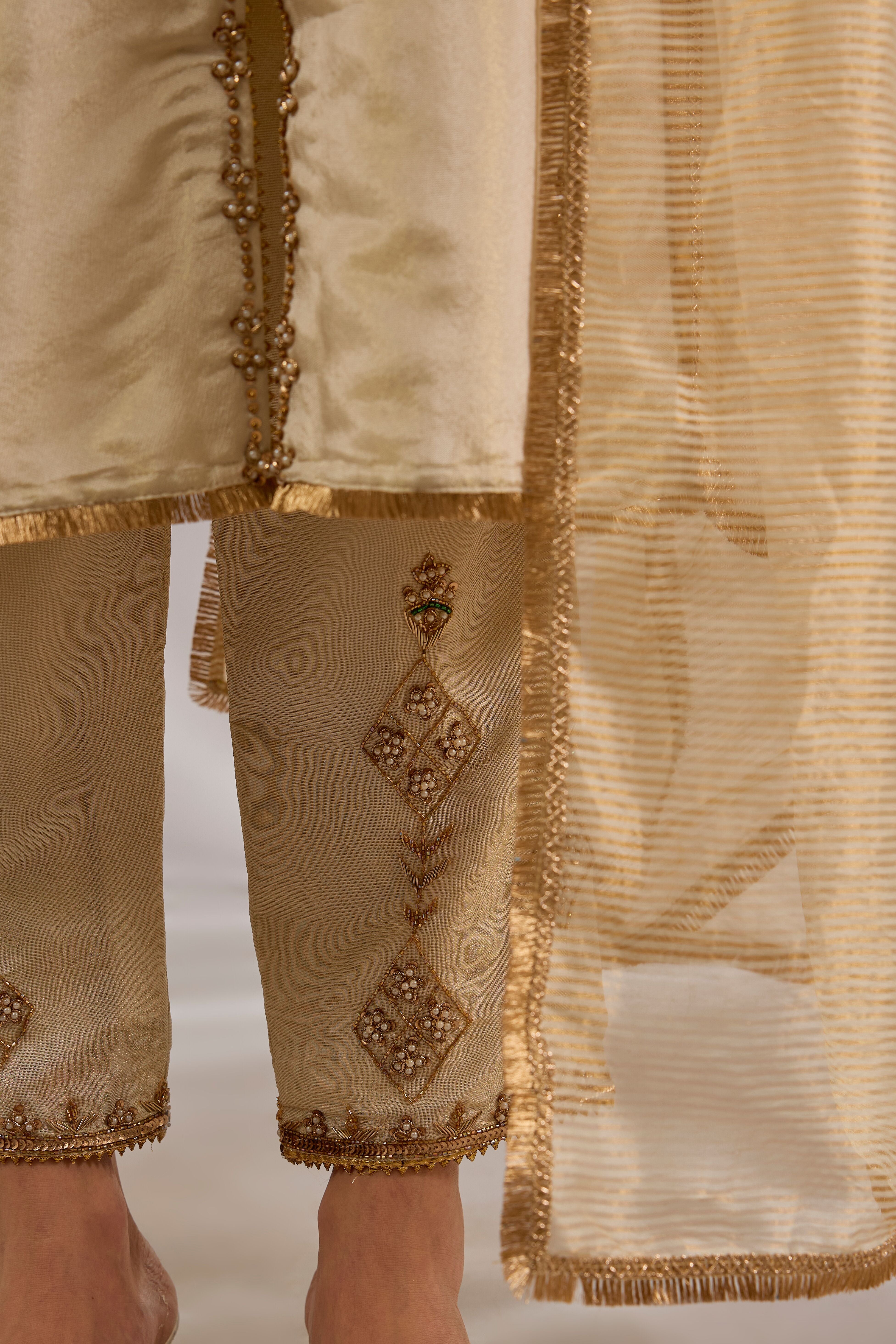 Princess flared kurta in tissue base with hand embroidery.