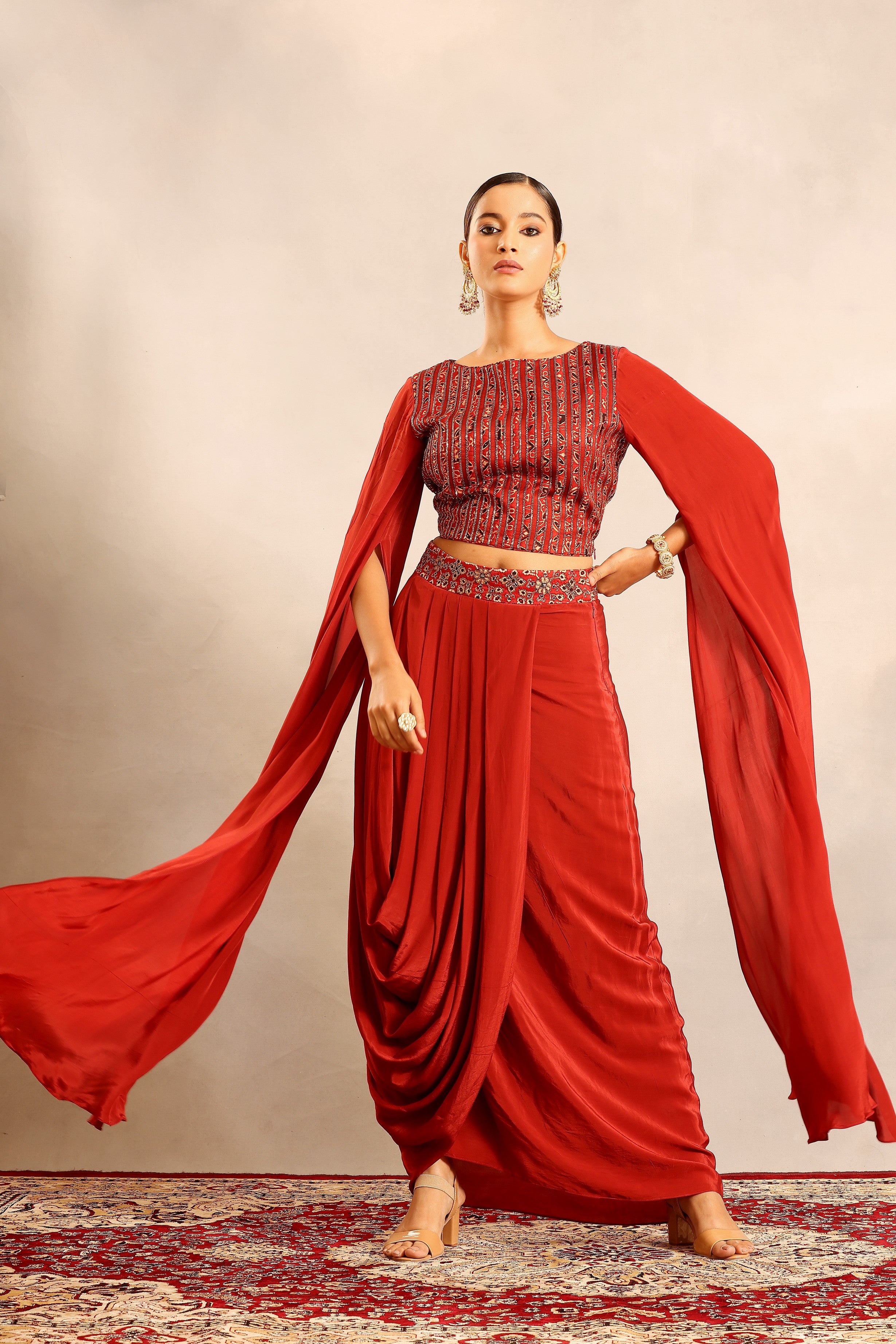 Red Ajrakh embroidered cape sleeve blouse with drape skirt