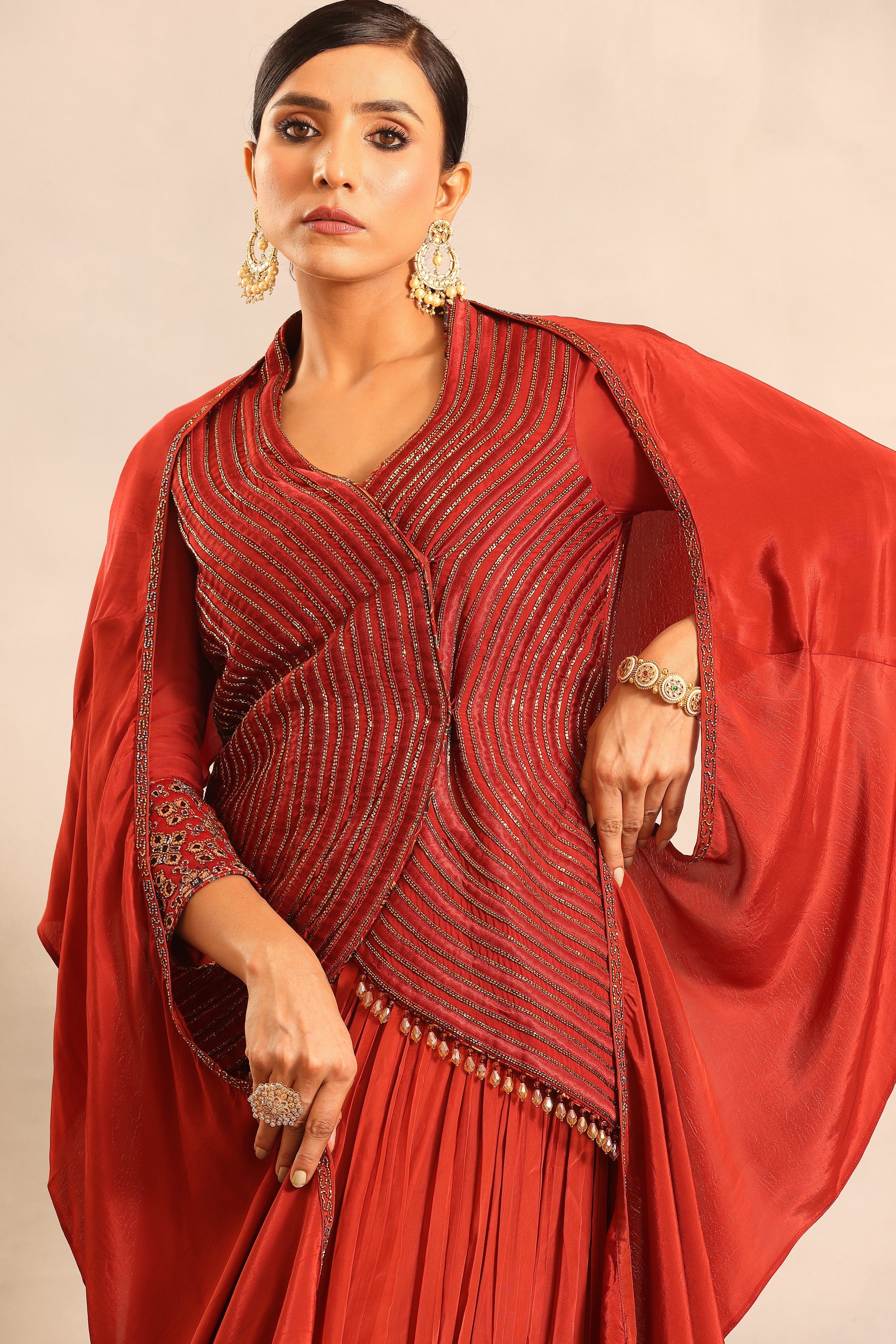Red strip embroidered overlap jacket with pleated skirt and ruffled dupatta