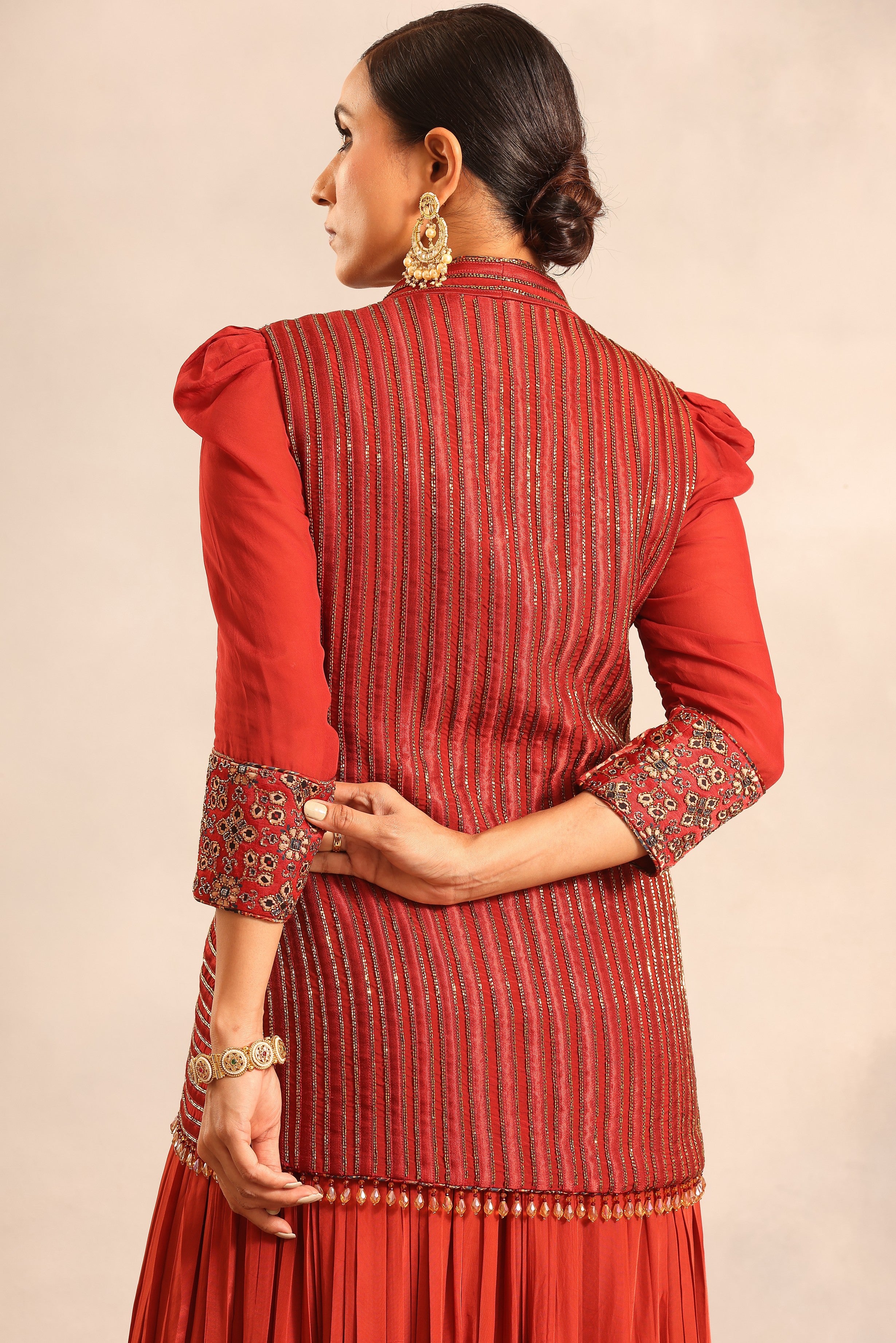 Red strip embroidered overlap jacket with pleated skirt and ruffled dupatta