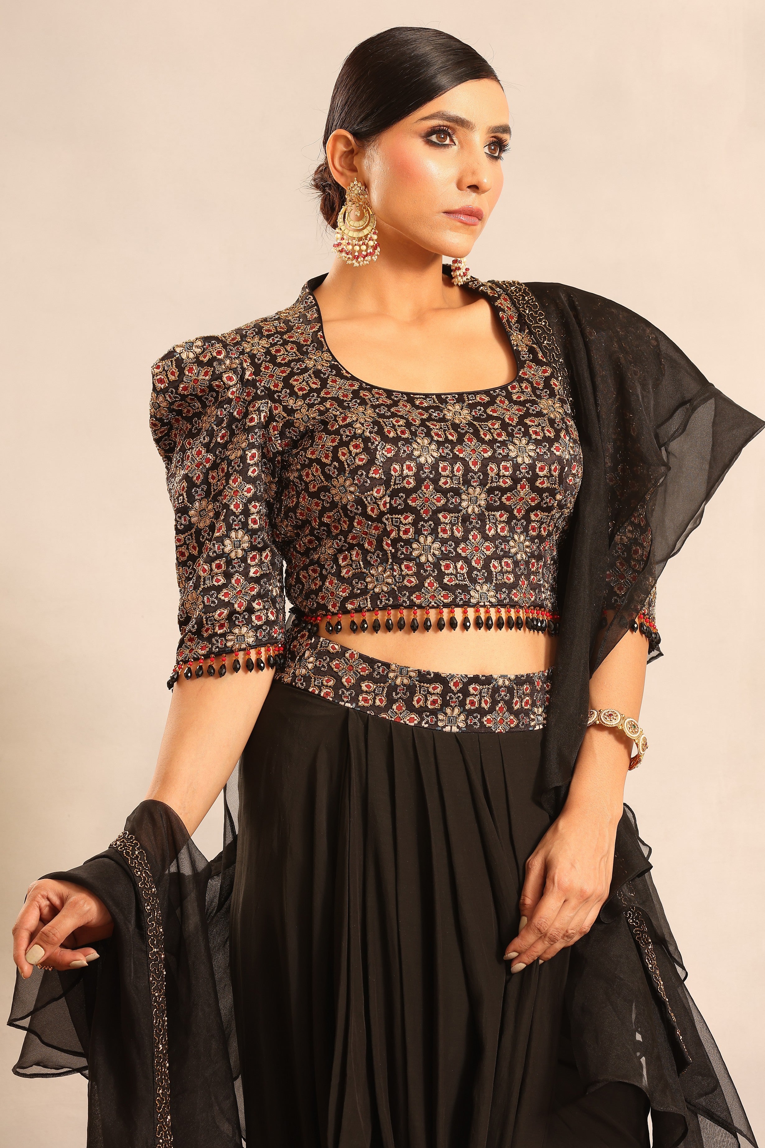 Black ajrakh embellished blouse with drape skirt and ruffle dupatta