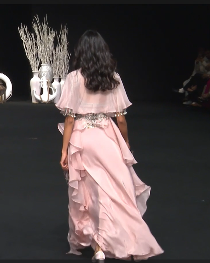 Peachy pink Ajrakh embroidered blouse paired up with Dhoti and ruffled dupatta