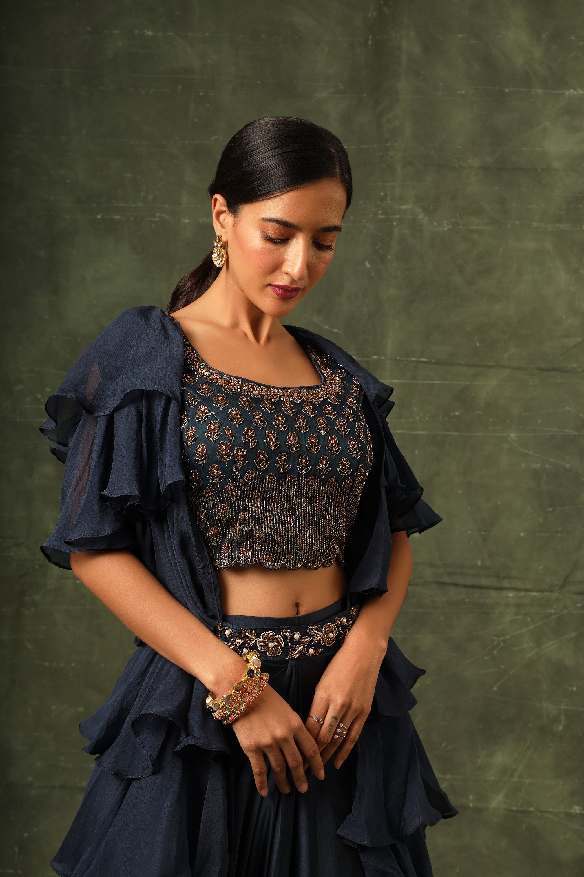 Blue Ajrakh blouse and layered jacket with embroiderd waisrband and drape dhoti