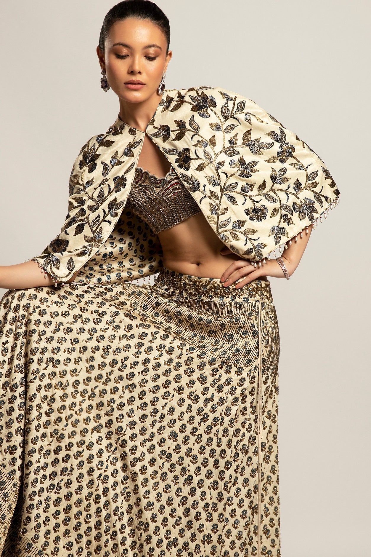 Lissome faded ivory blouse & Cape with Comely lehenga