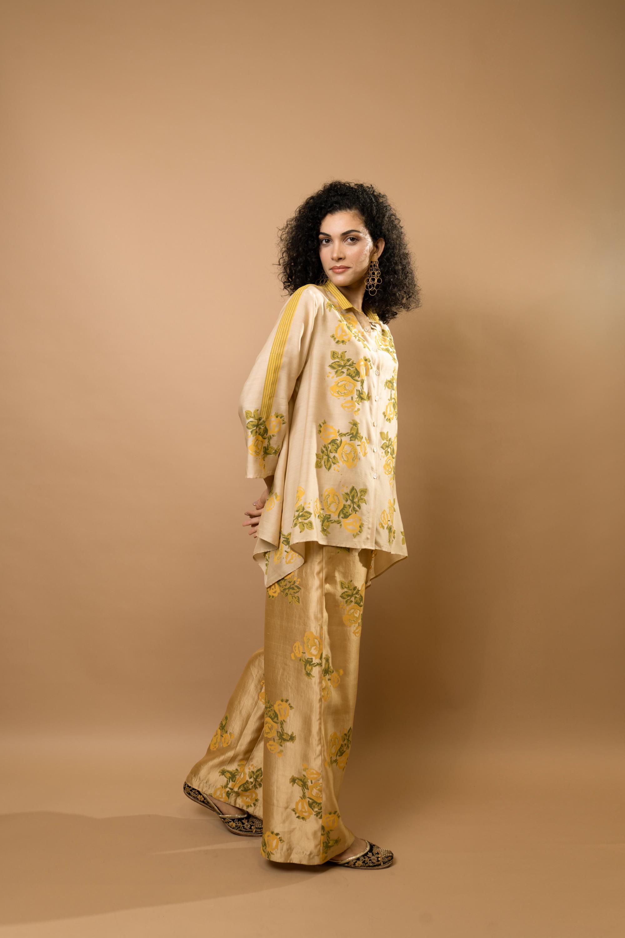 Beige rosettes block-printed asymmetrical hem shirt