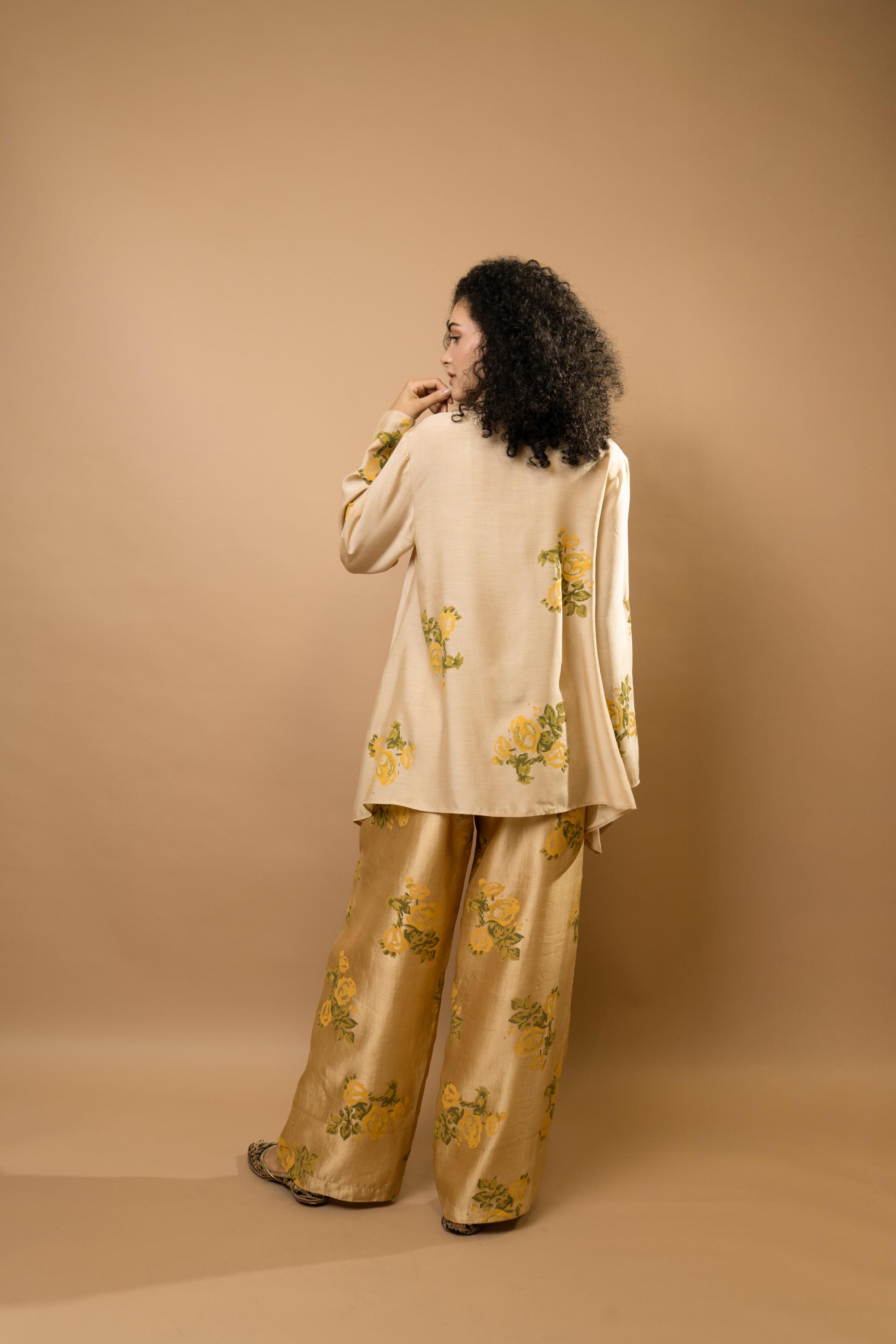 Beige rosettes block-printed asymmetrical hem shirt