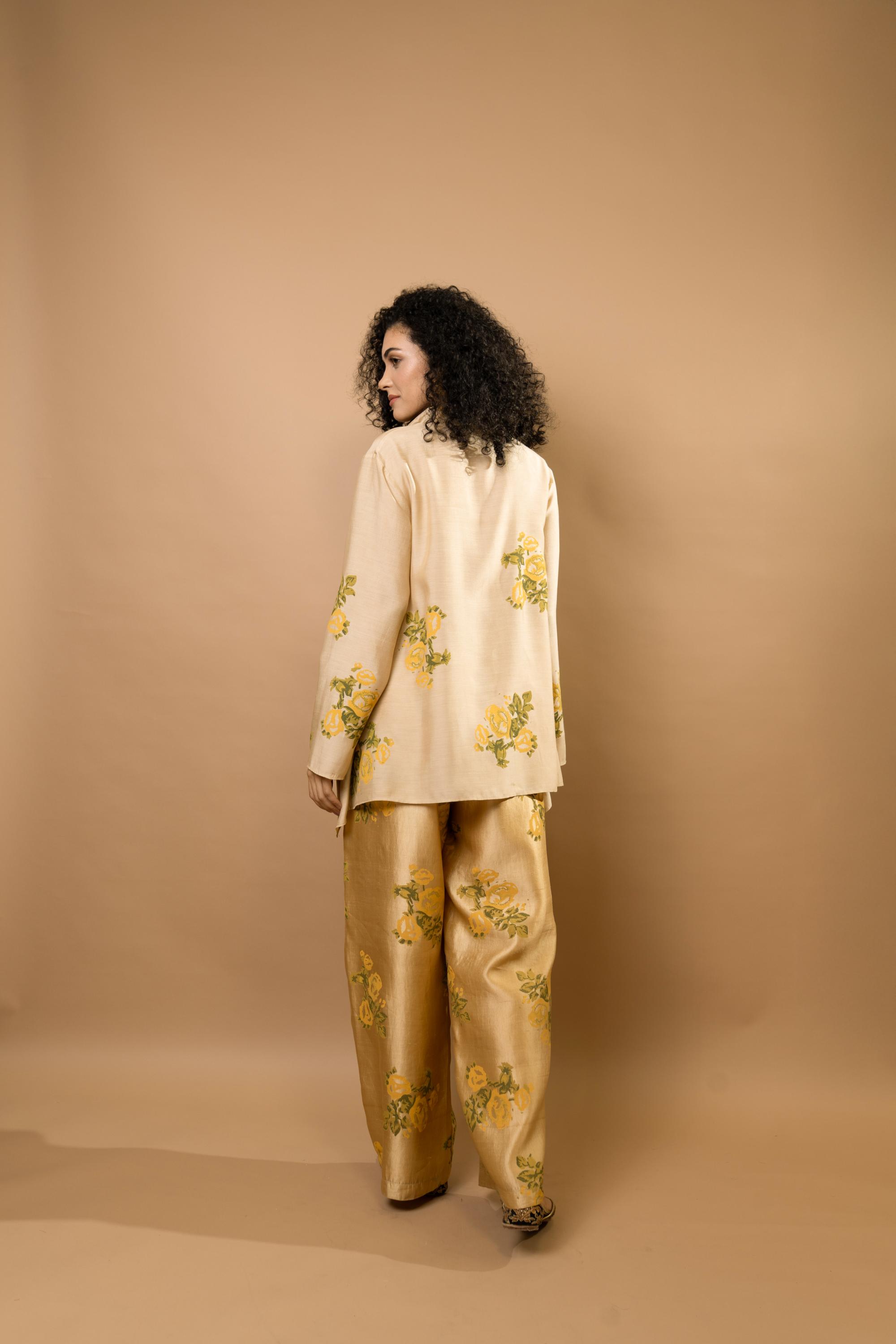 Beige rosettes block-printed asymmetrical hem shirt