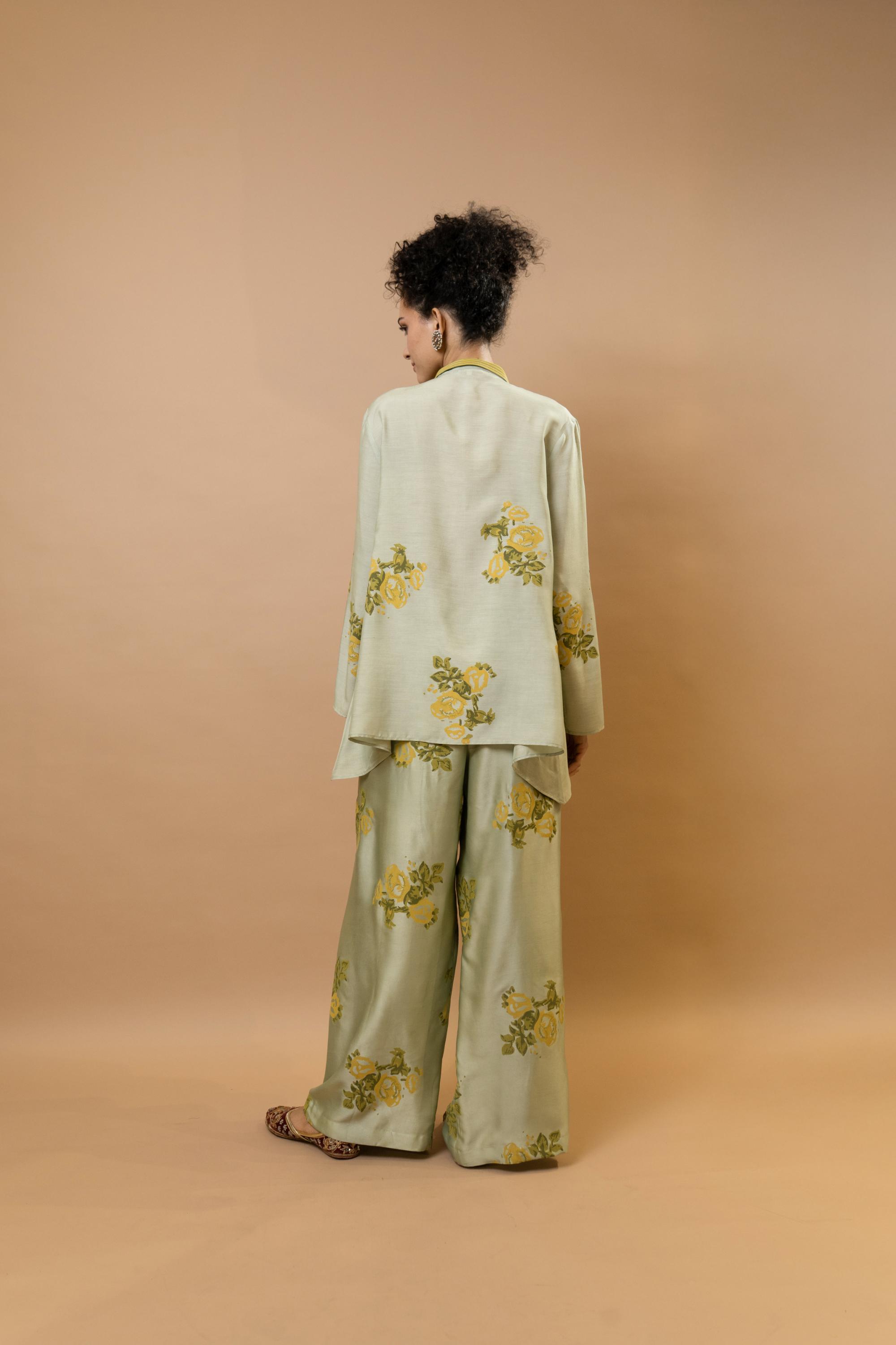 Beige rosettes block-printed asymmetrical hem shirt