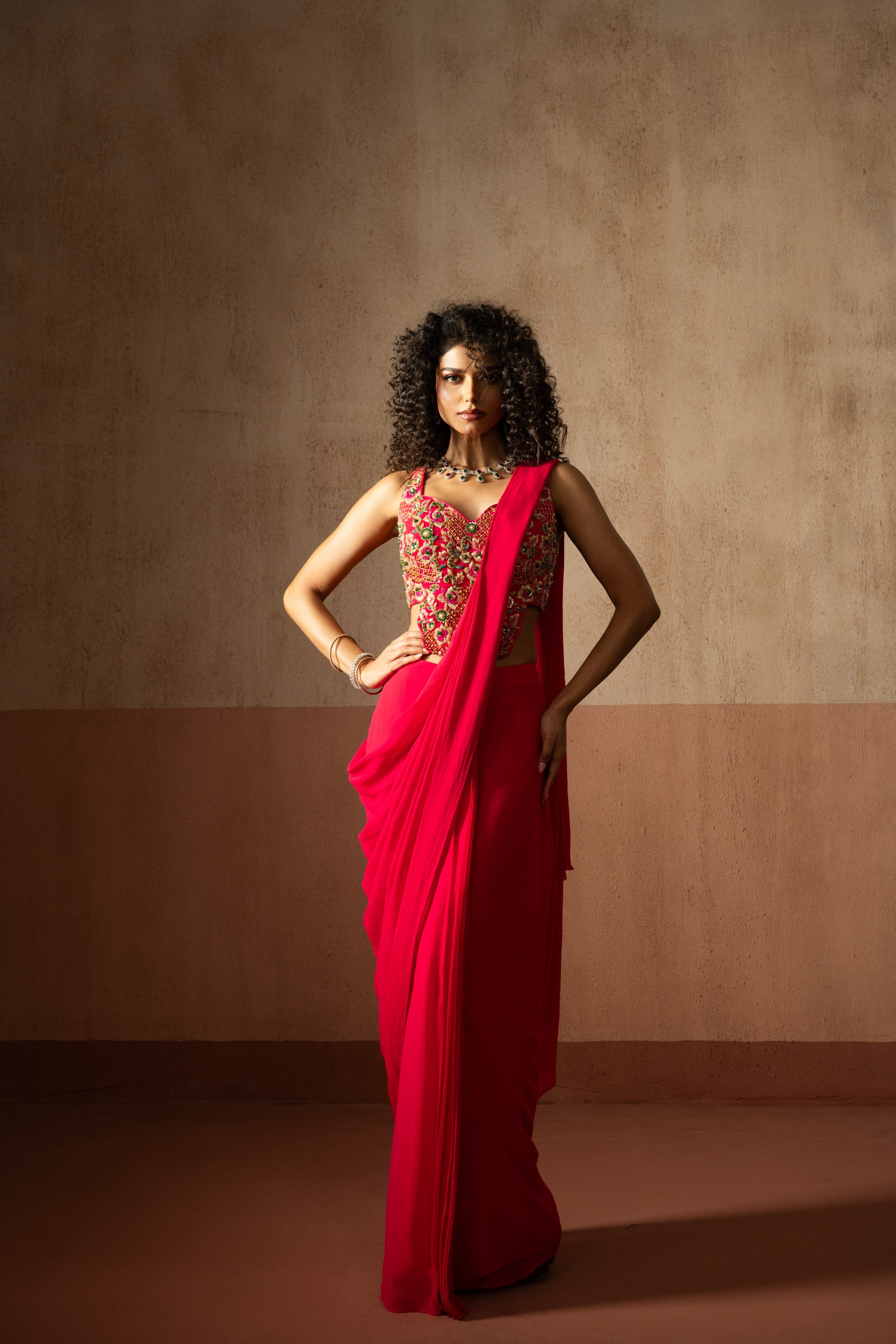 Predraped , fuschia pink , embroidered georgette saree with corset blouse