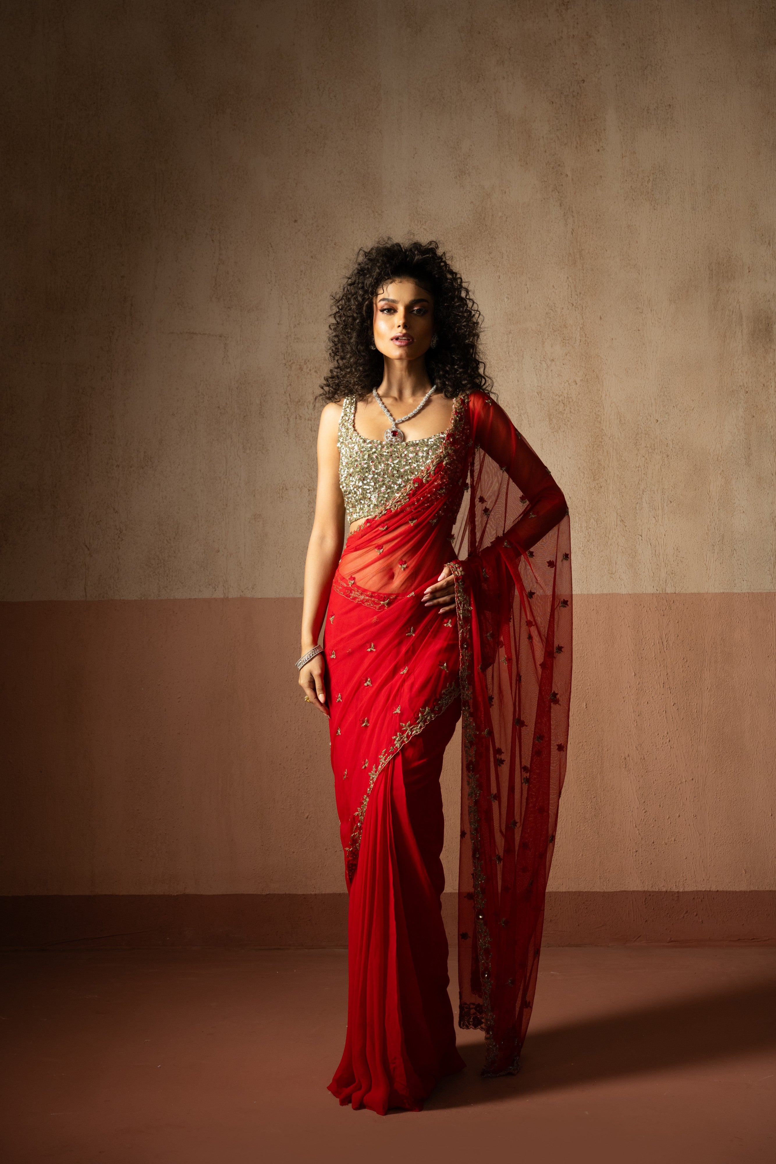 Predraped , red , hand embroidered net & georgette saree with golden blouse