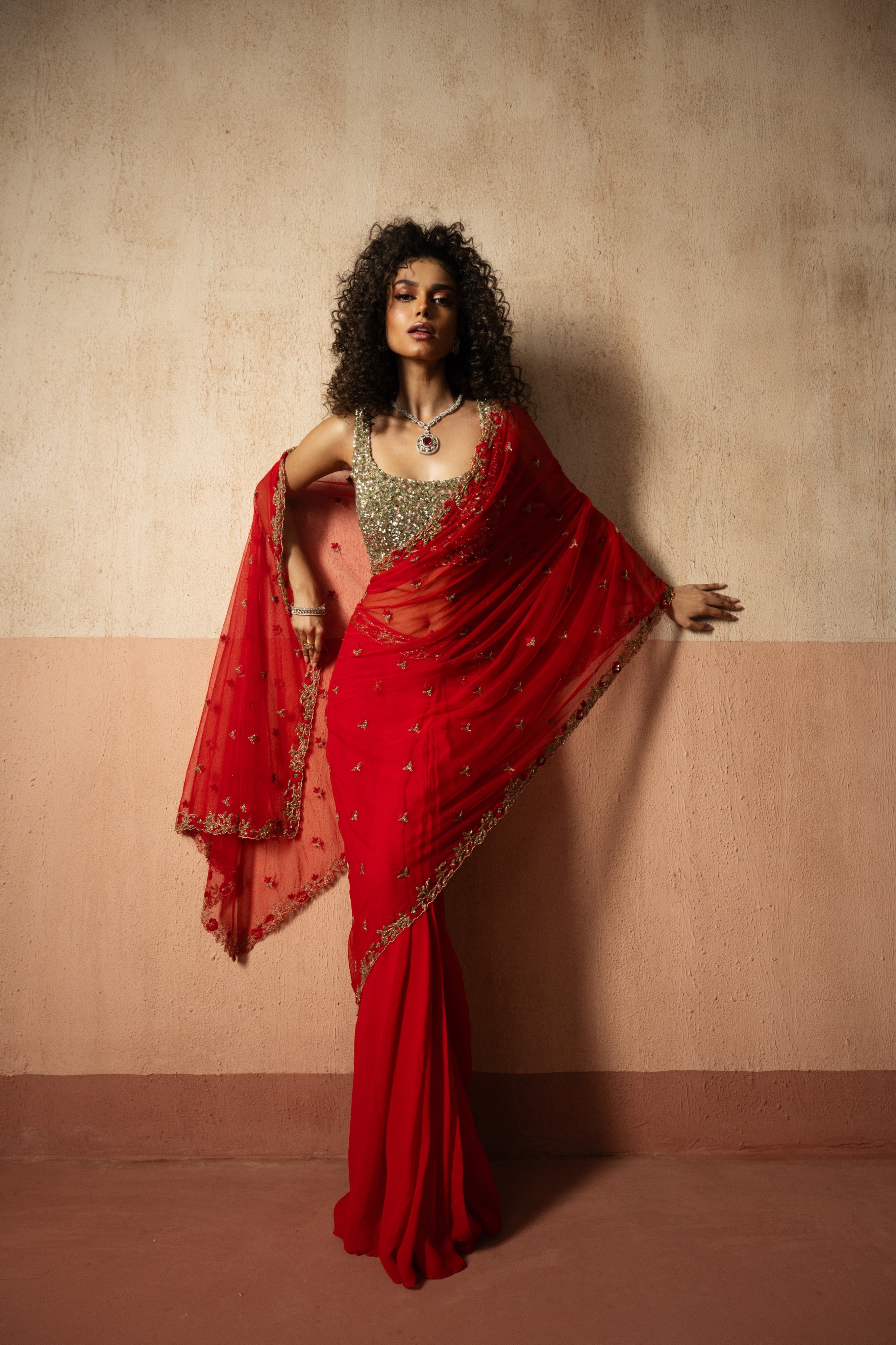 Predraped , red , hand embroidered net & georgette saree with golden blouse