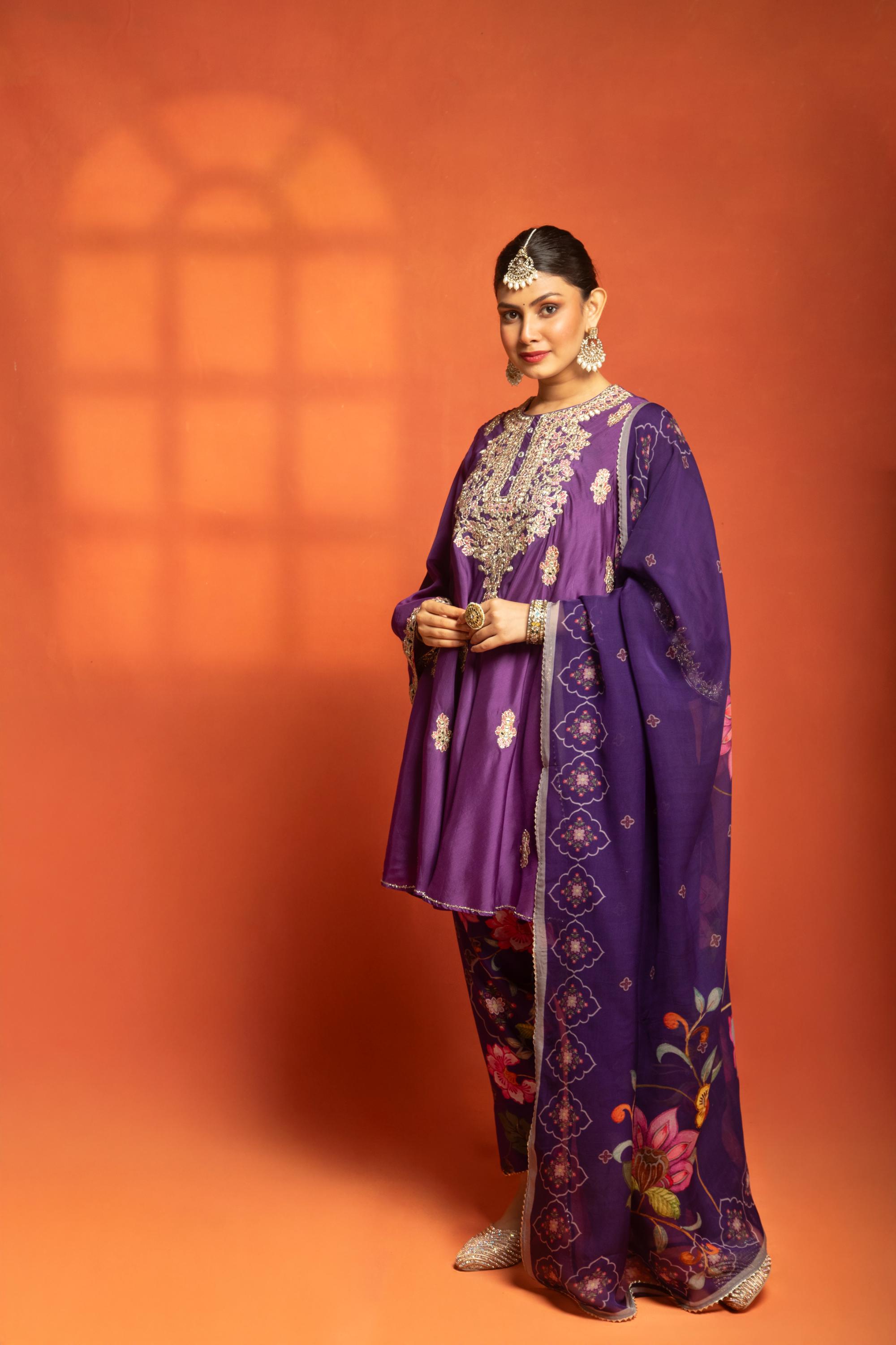 Purple Short Semi- Anarkali with a heavily Embroidered Neckline, Paired with Floral Printed Salwar Pants & Dupatta