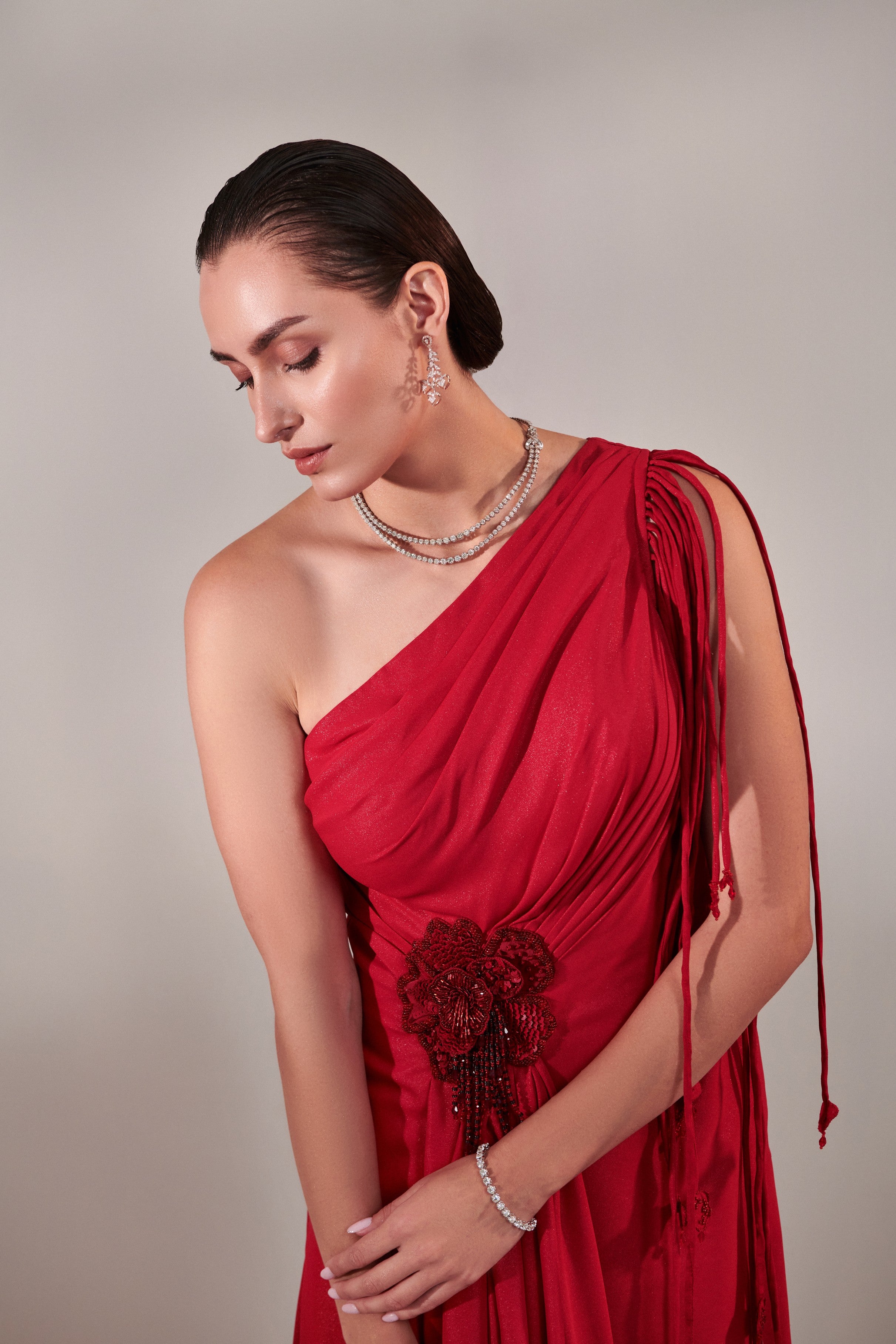 Draped scarlet gown with 3d hand embroidered flower detail on front
