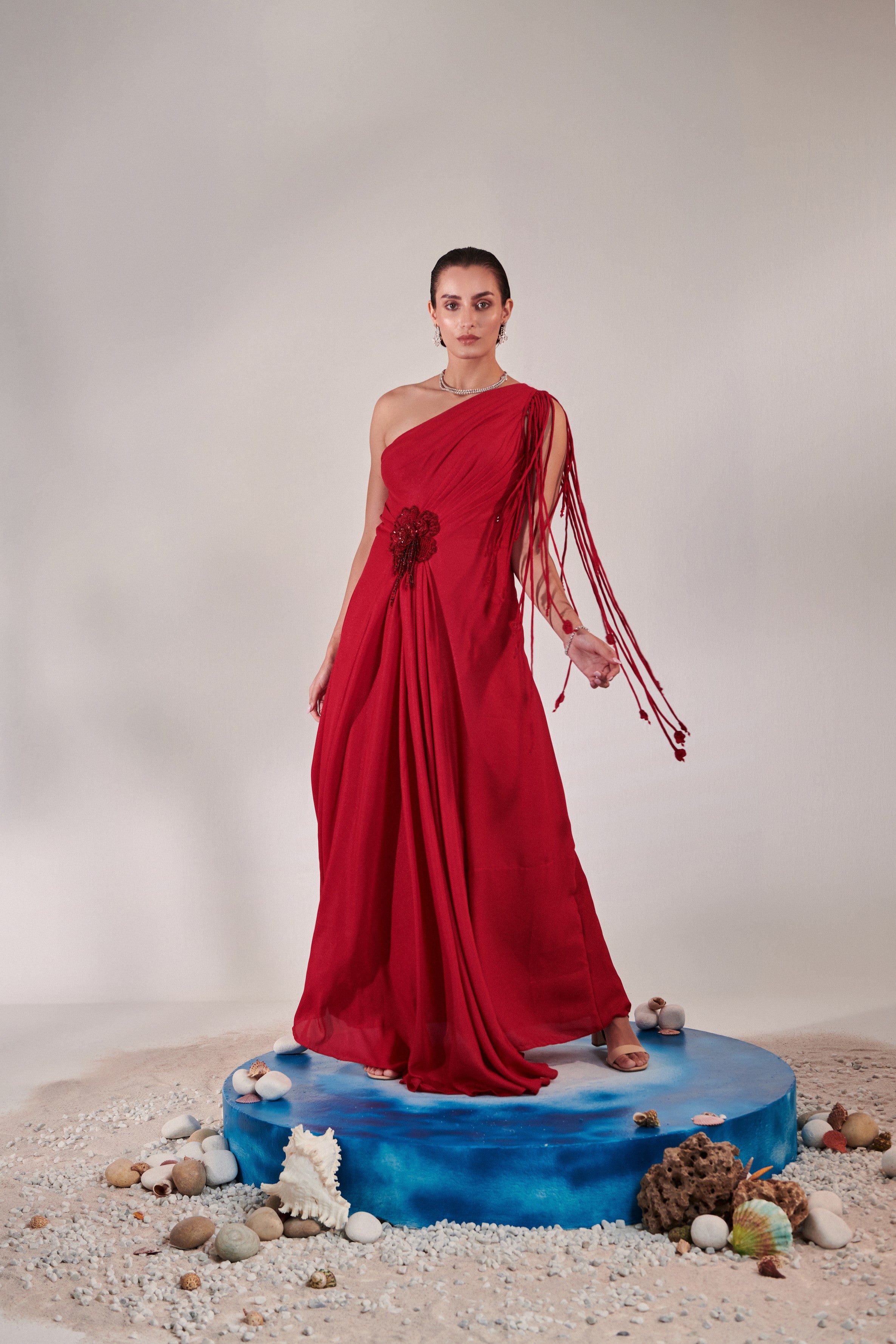 Draped scarlet gown with 3d hand embroidered flower detail on front