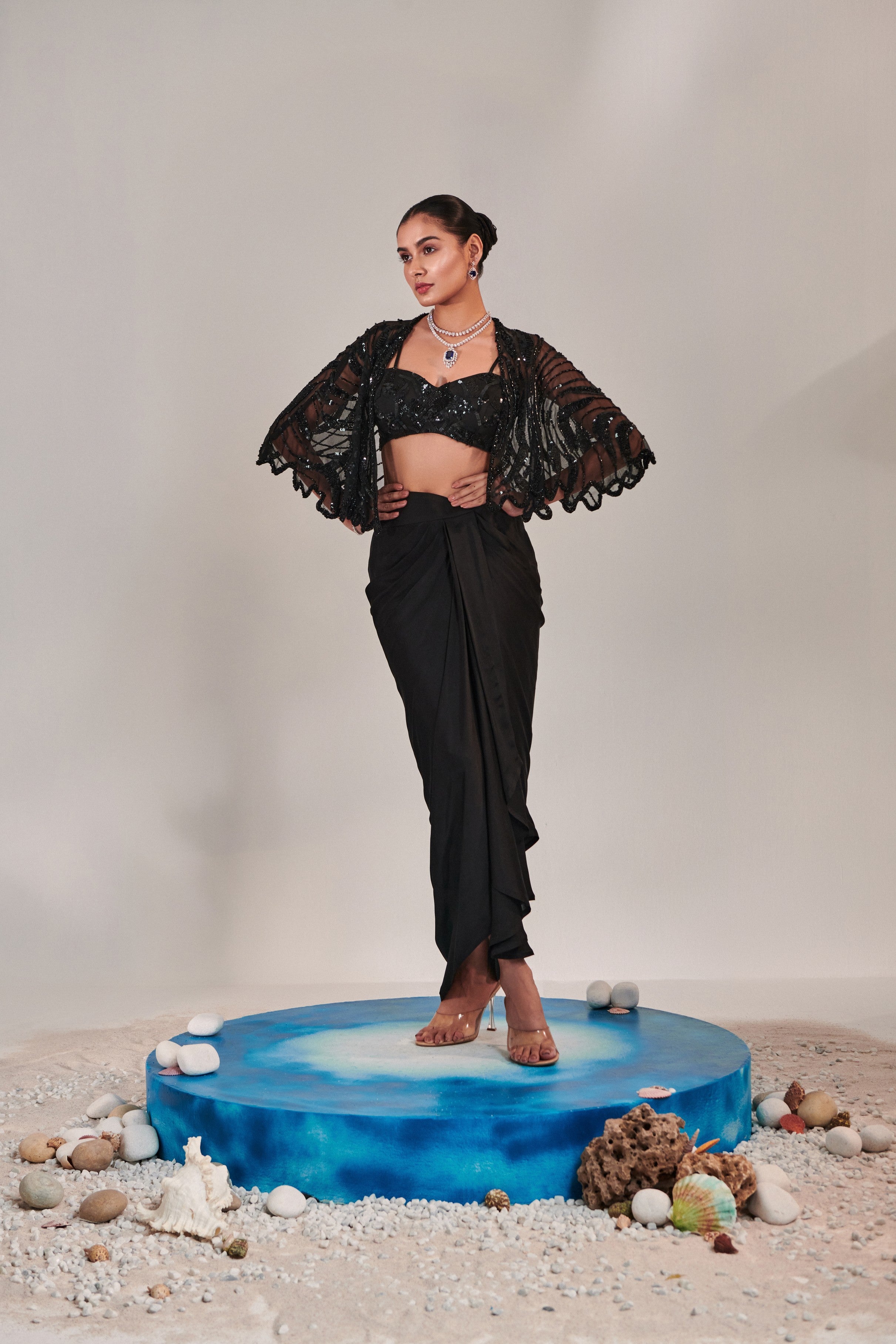hand embroidered scallop short cape; asymmetric drape slit skirt; broad asymmetric waistbelt