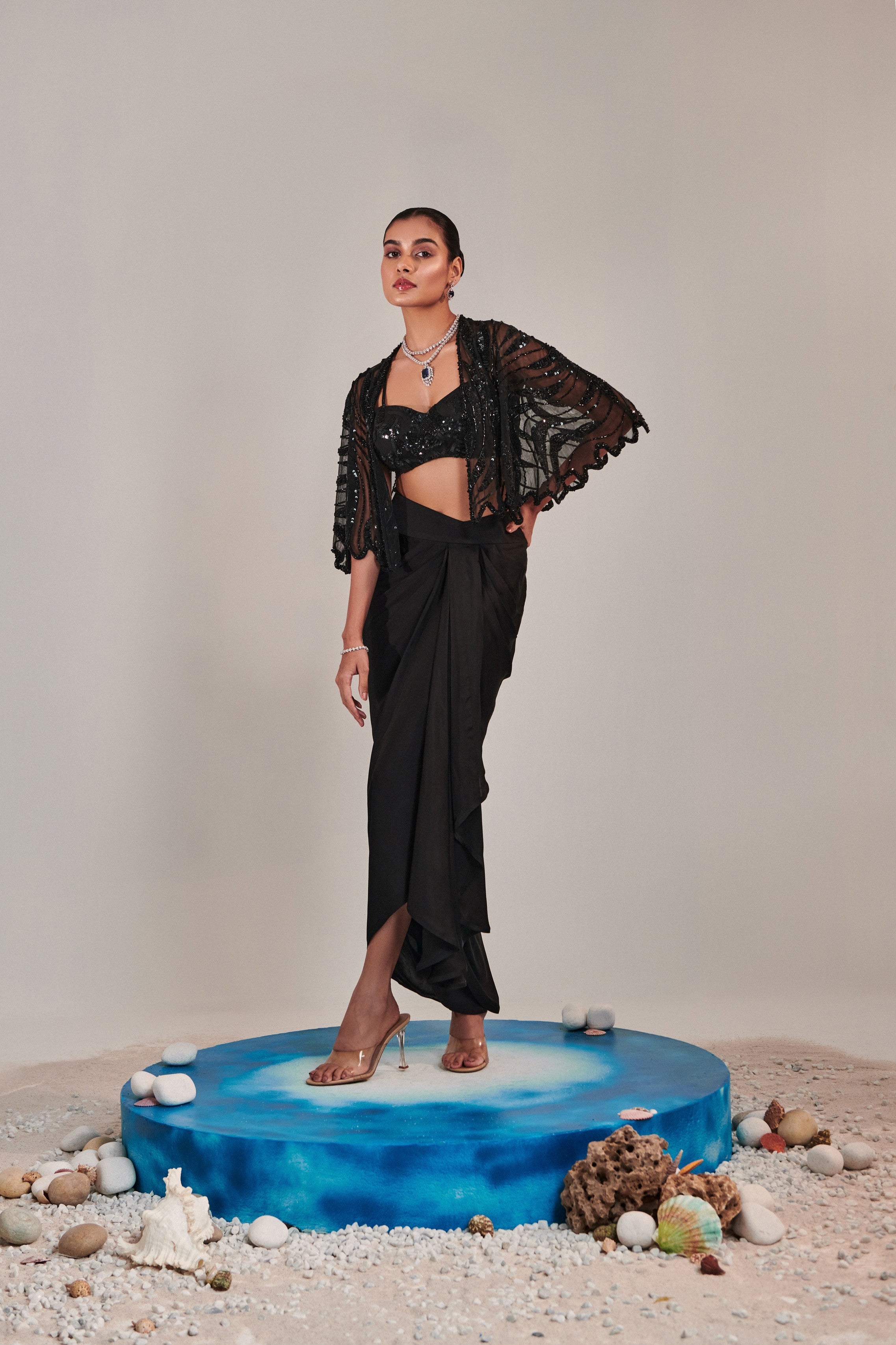 hand embroidered scallop short cape; asymmetric drape slit skirt; broad asymmetric waistbelt
