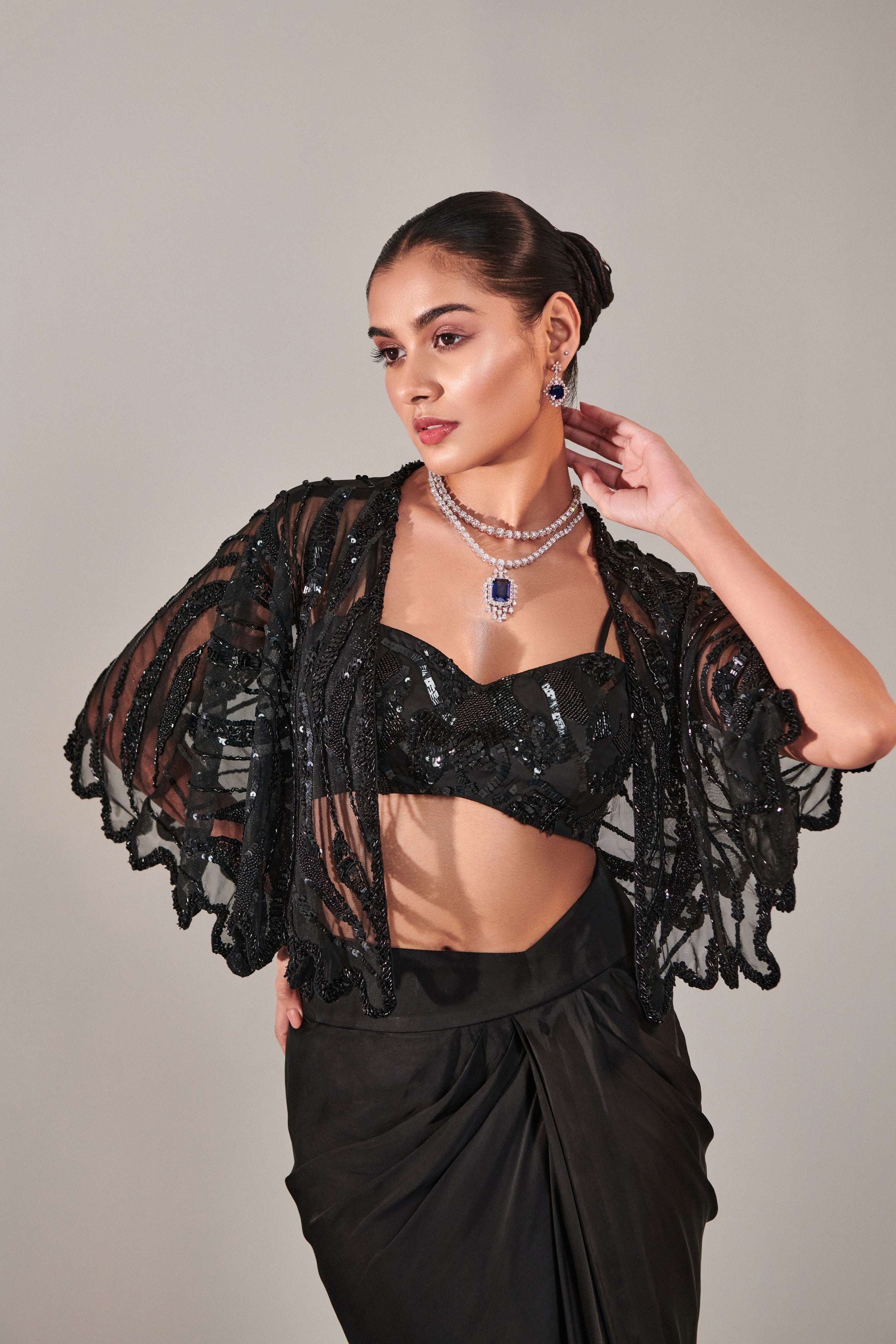 hand embroidered scallop short cape; asymmetric drape slit skirt; broad asymmetric waistbelt