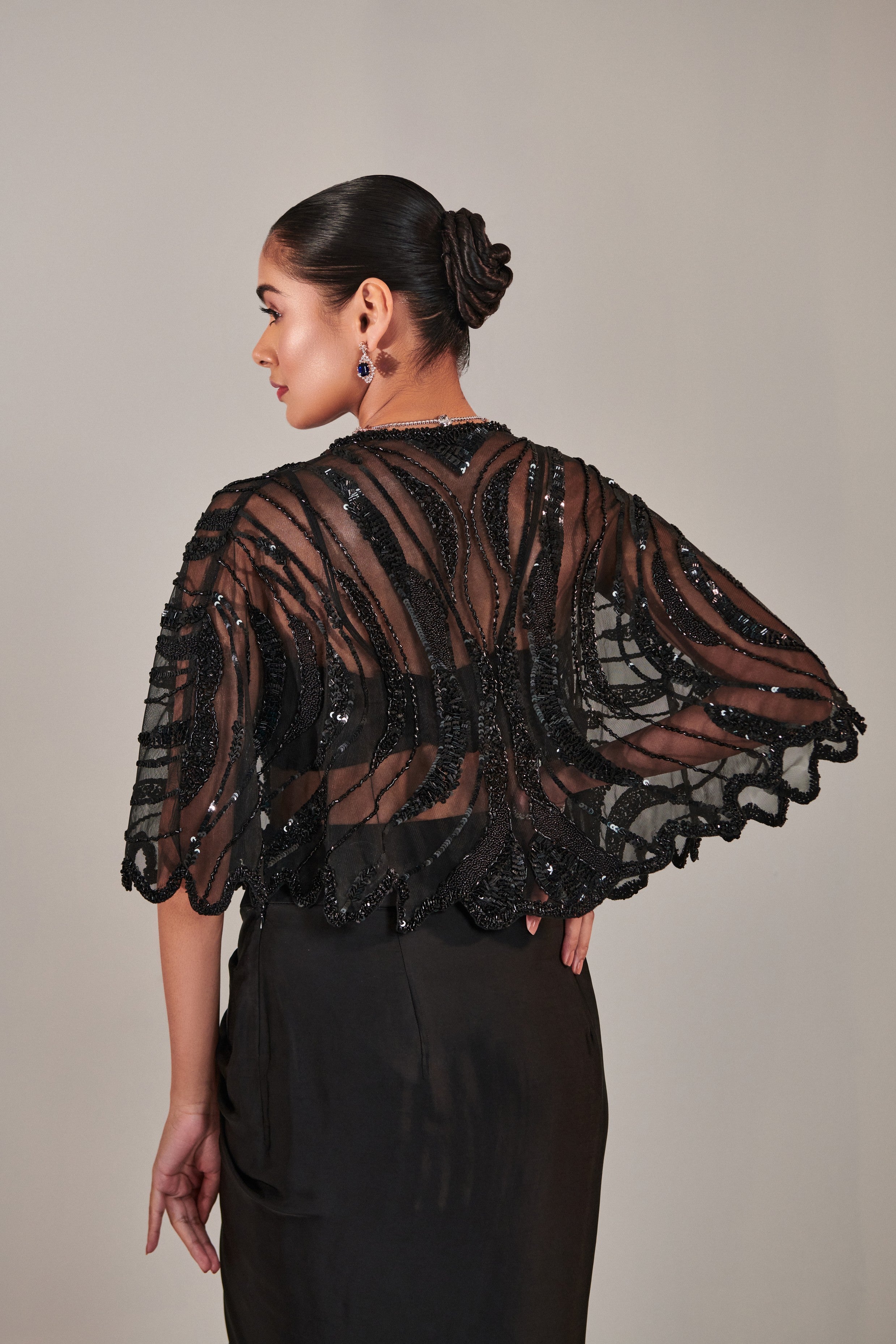 hand embroidered scallop short cape; asymmetric drape slit skirt; broad asymmetric waistbelt