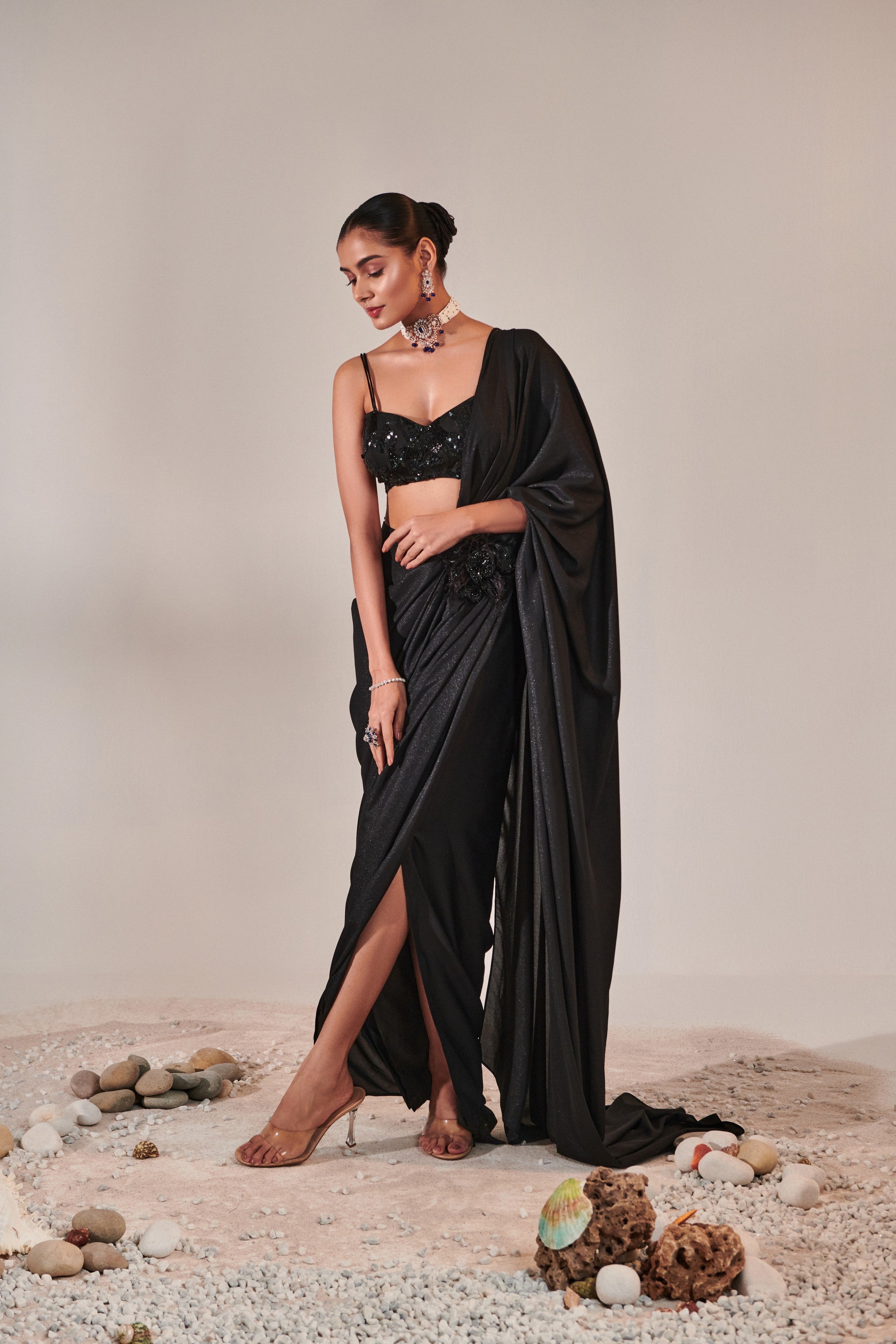 fuss-free pre-stitched drape saree; hand embroidered blouse and feather detailing