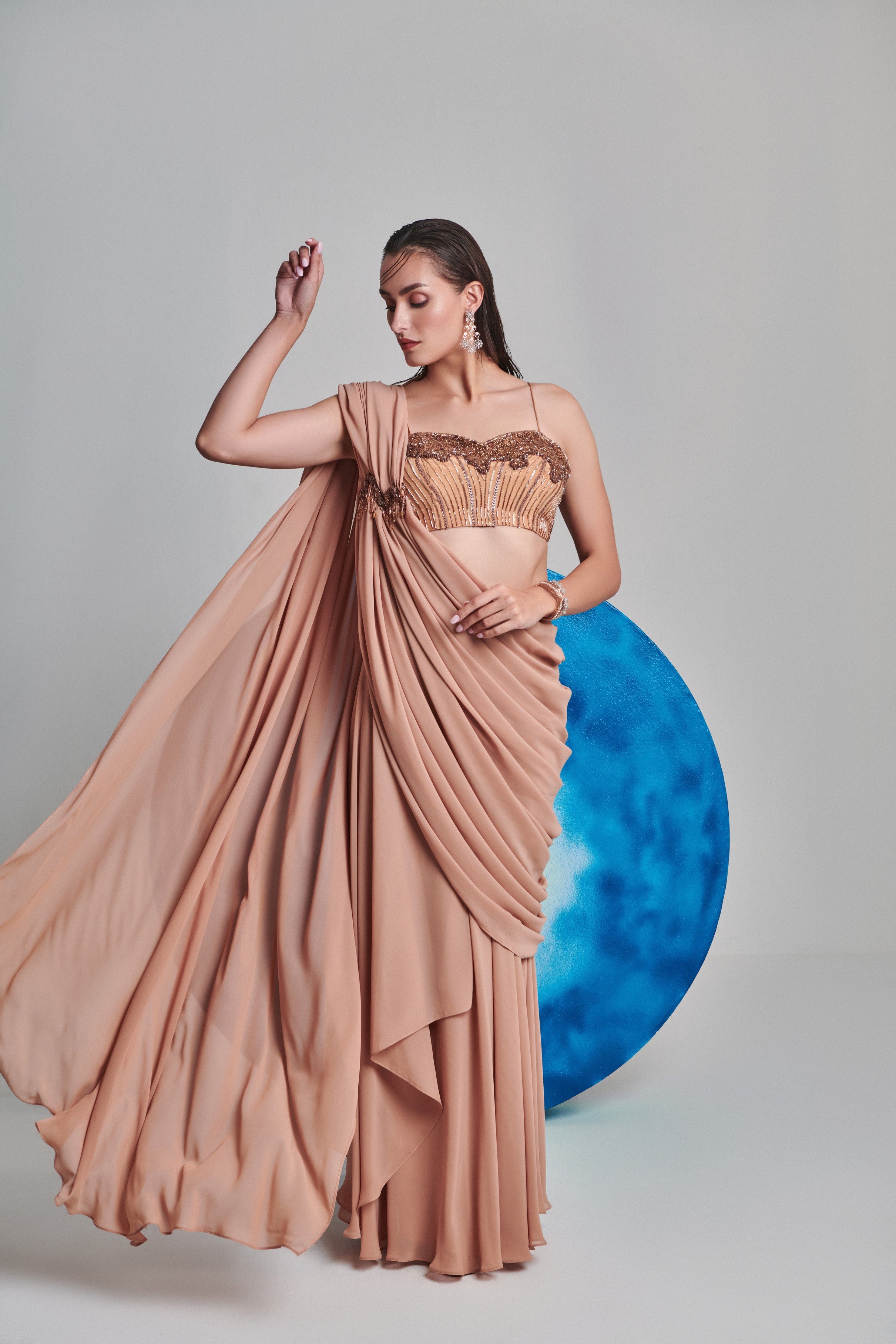 Beige flared pre stitch drape saree; hand embroidered blouse