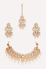 Elegant and classy kundan necklace set with earrings and maangtikka studded with pearls