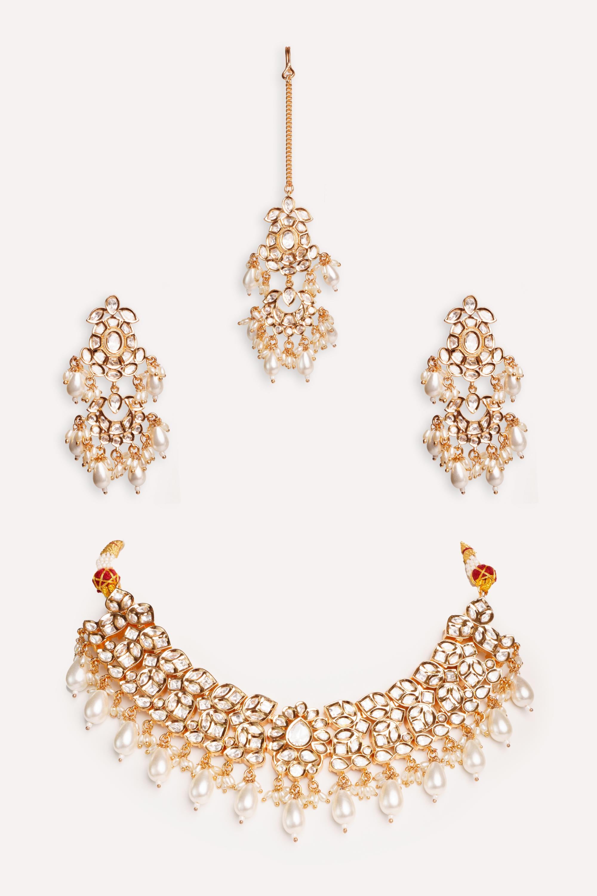 Elegant and classy kundan necklace set with earrings and maangtikka studded with pearls