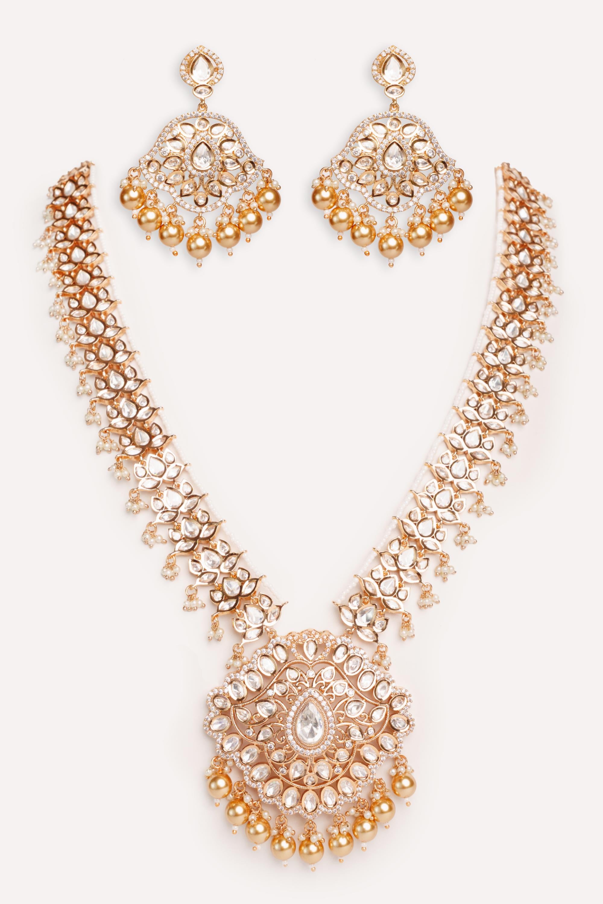 Bold and dramatic kundan long pendant necklace with elegant earrings