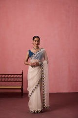 Ivory organza heavy scalloped cutwork embroidered saree comes with unstitched & unembroidered blouse fabric in chanderi
