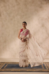 Ivory organza french knot jaal & paisley work saree comes with unstitched & unembroidered blouse fabric in chanderi