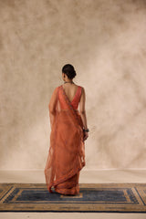 Peach organza scalloped embroidered saree comes with unstitched & unembroidered blouse fabric in chanderi
