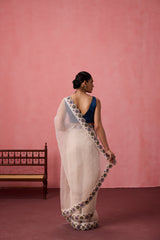 Ivory organza heavy scalloped cutwork embroidered saree comes with unstitched & unembroidered blouse fabric in chanderi