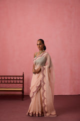 Cozy peach organza heavy scalloped border saree comes with unstitched & unembroidered blouse fabric in chanderi