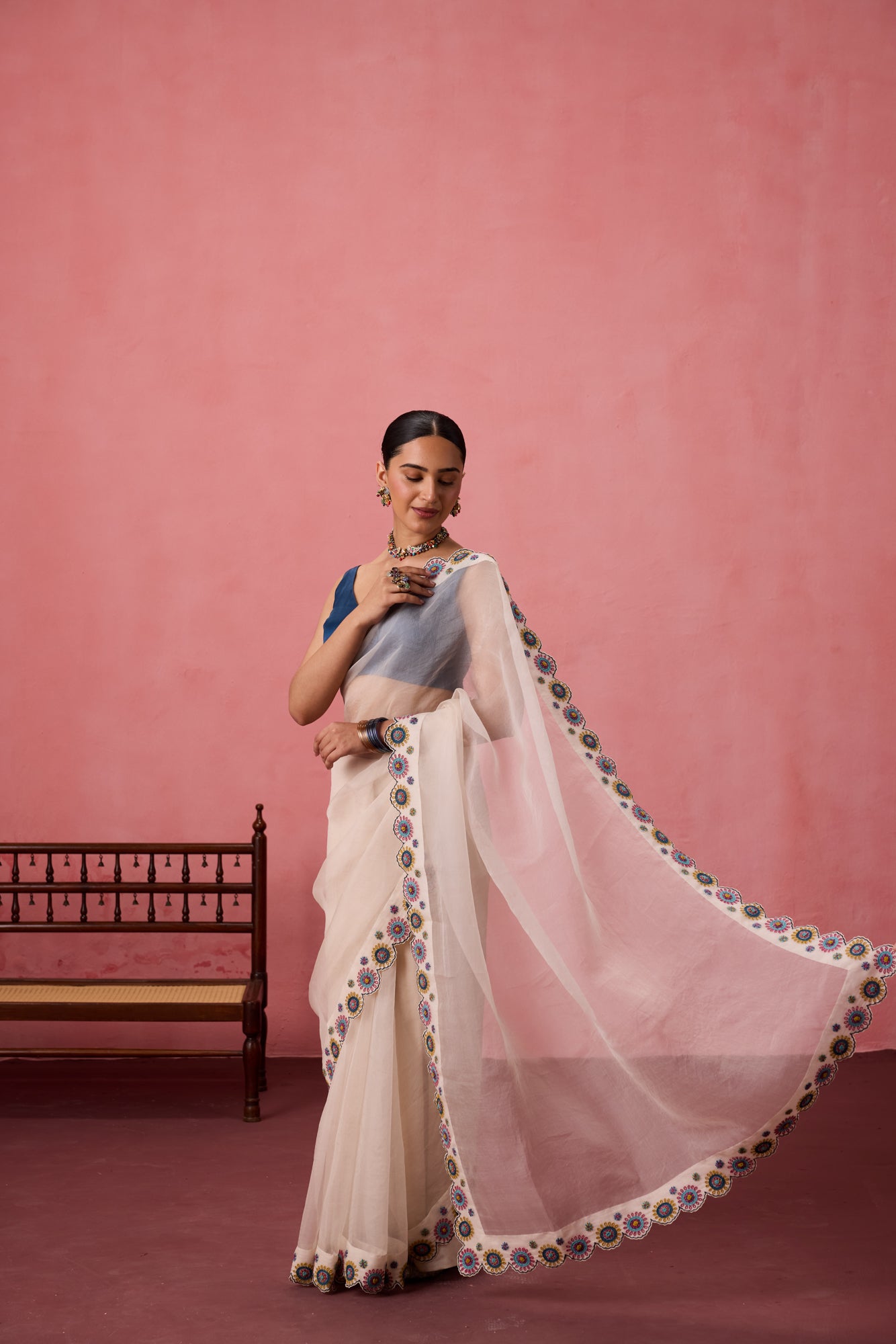Ivory organza heavy scalloped cutwork embroidered saree comes with unstitched & unembroidered blouse fabric in chanderi