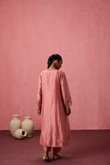 Peach chanderi embroidered kurta with embellished border on sleeves paired with an organic cotton slip pant & organza dupatta
