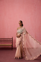 Cozy peach organza heavy scalloped border saree comes with unstitched & unembroidered blouse fabric in chanderi