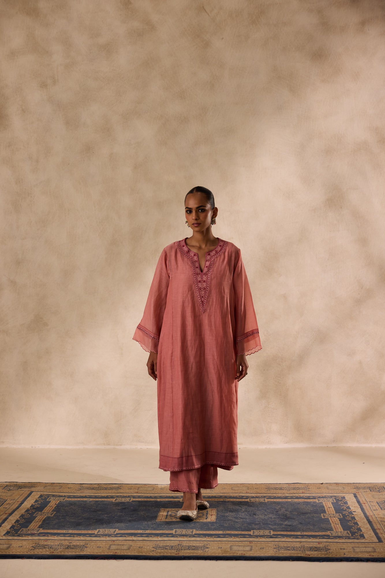 Peach chanderi heavy neckline resham embroidred kurta paired with organic cotton slip,pant & heavy border dupatta