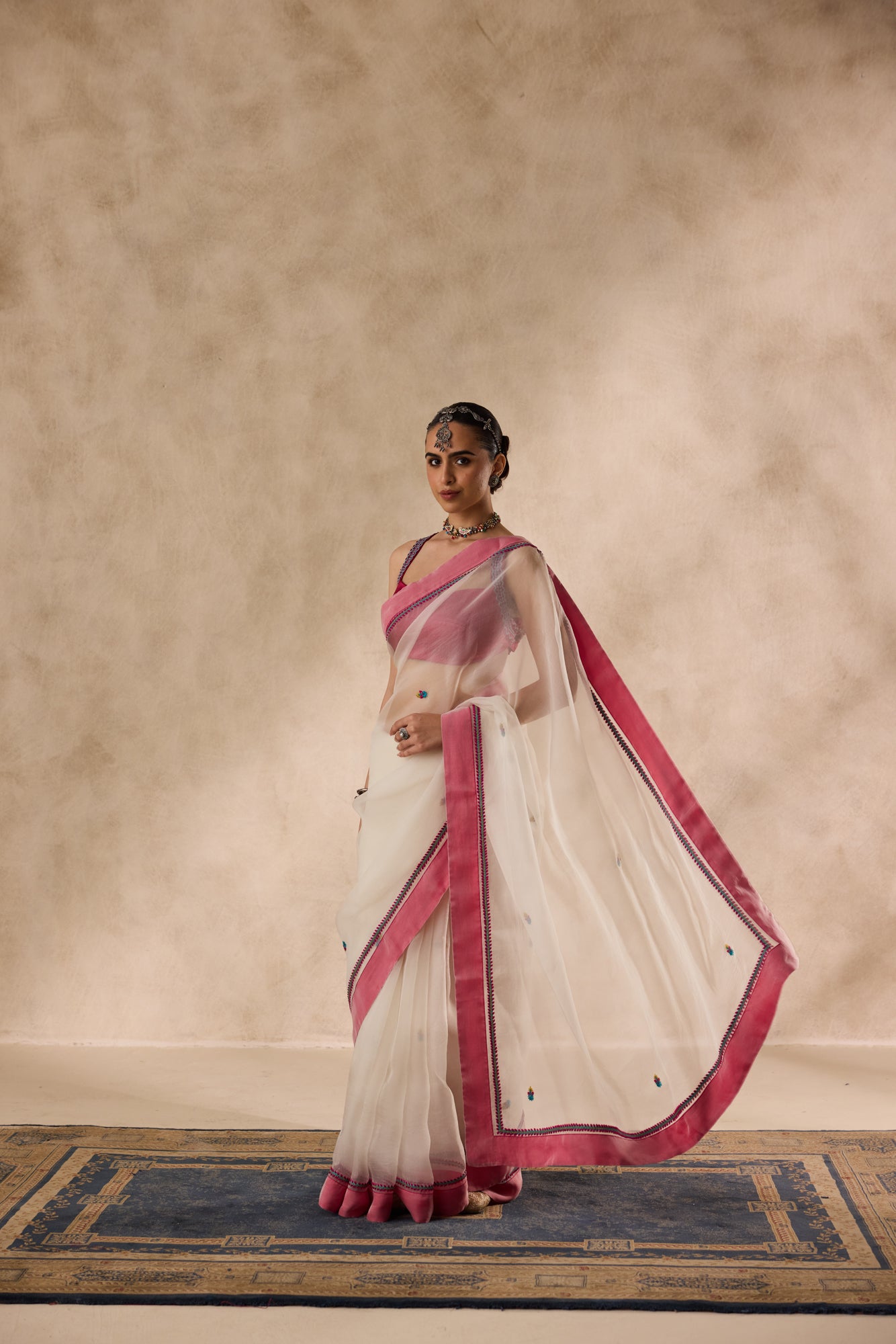 Ivory organza rasham buti embroidered saree comes with unstitched & unembroidered blouse fabric in chanderi
