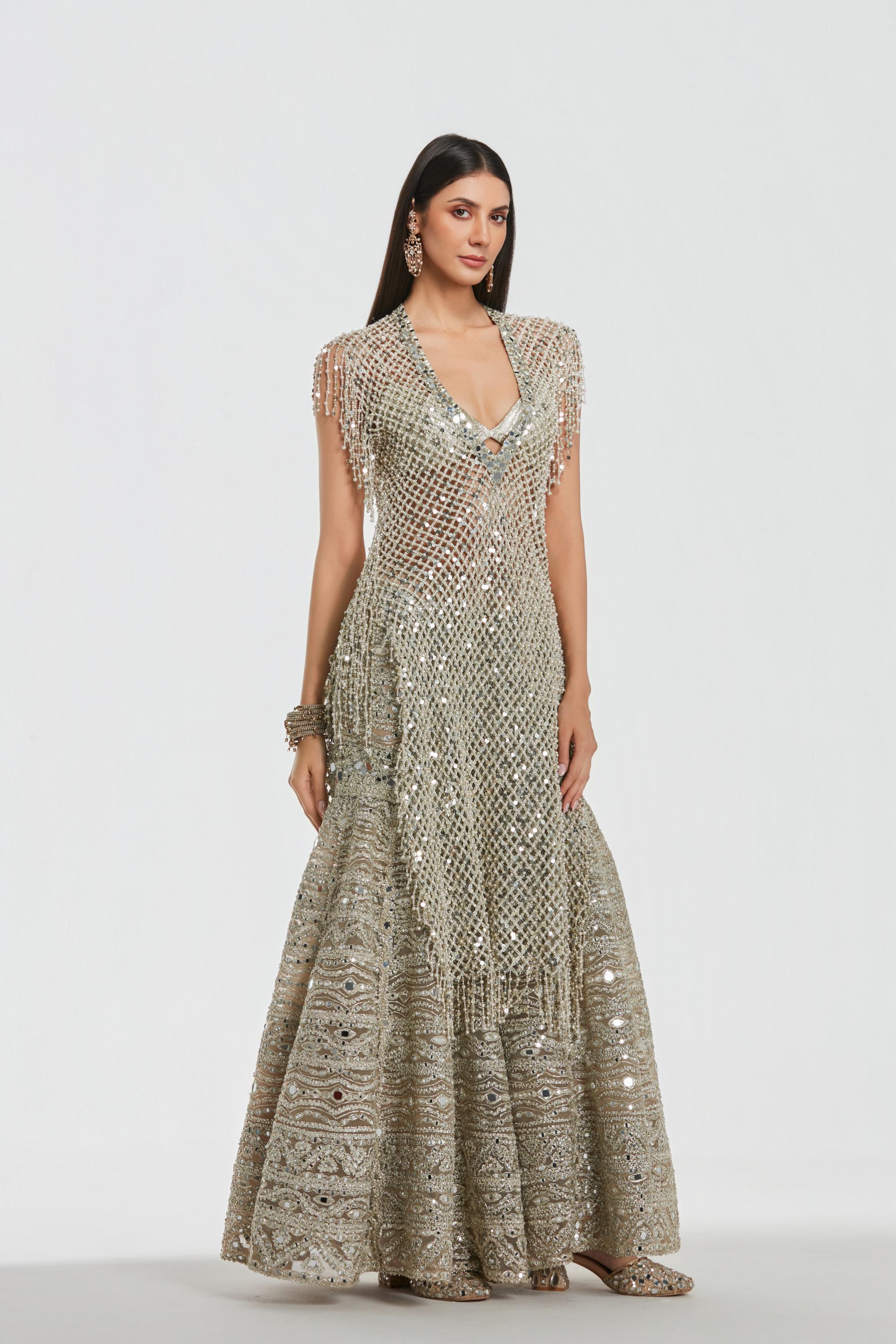 Mirror work , pearl beads, zari , sequins ,gota