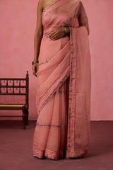 Peach organza embroidered saree comes with unstitched & unembroidered blouse fabric in chanderi