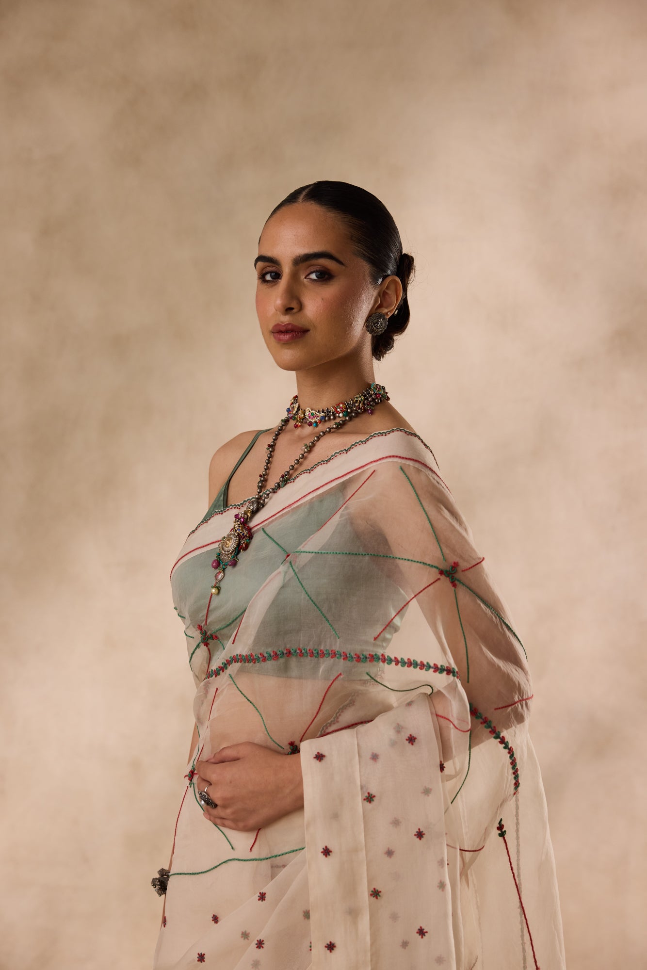 Ivory organza resham and thread embroidered saree comes with unstitched & unembroidered blouse fabric in chanderi